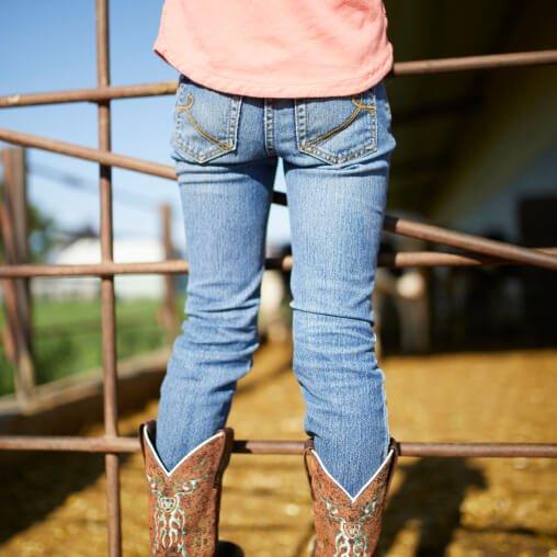 Kid in Ariat Jeans