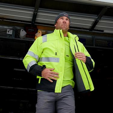 man in ariat reflective work clothing