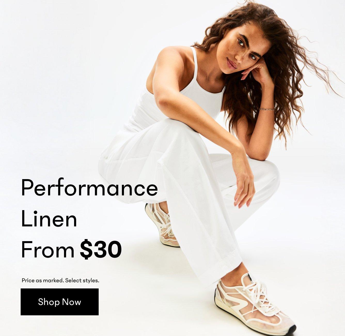 a woman in white pants posing for a photo with the words performance line from $ 30