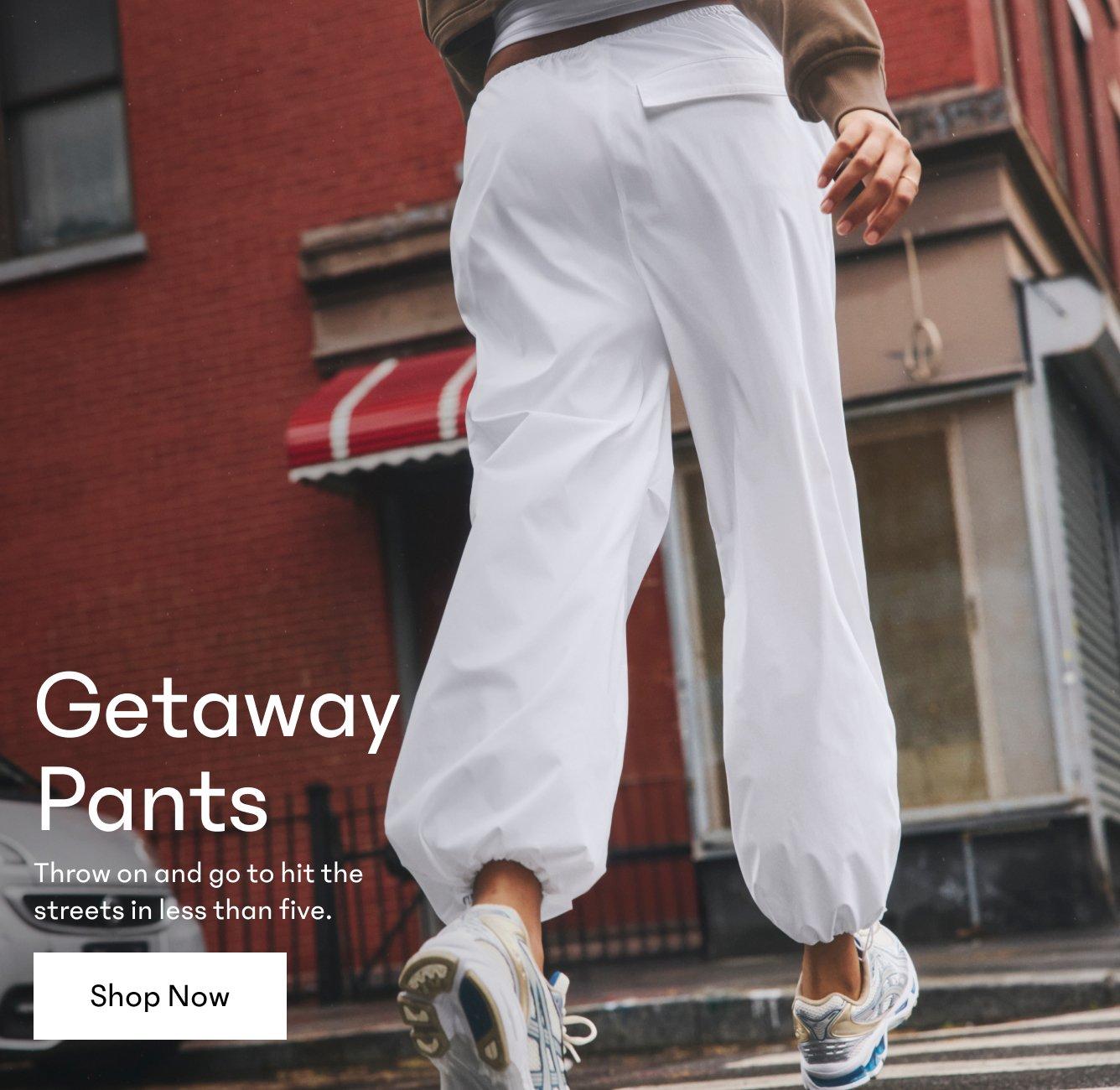 Getaway Pants. Throw on and go to hit the  streets in less than five. Shop Now. a woman walking down the street in white pants.