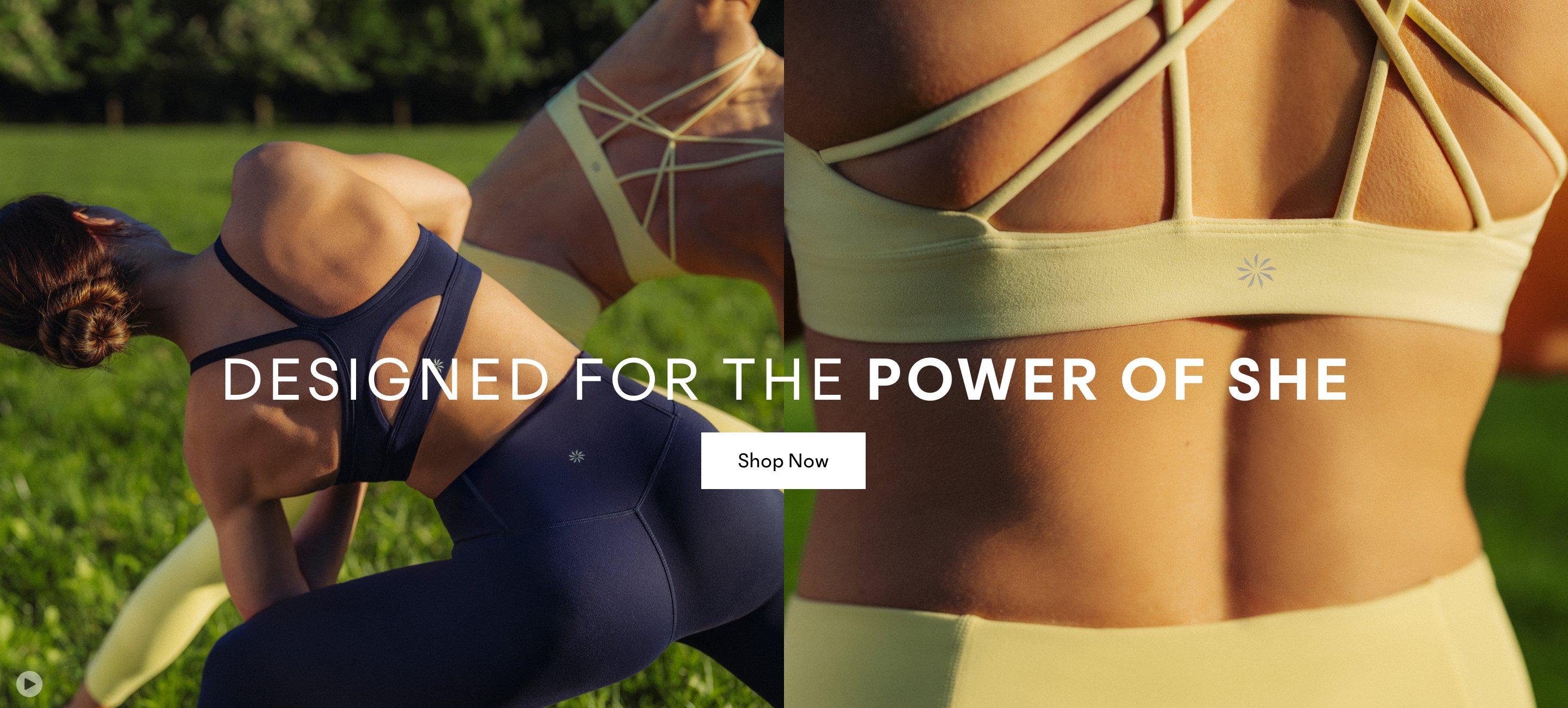 a woman in a blue top walking down a street. Designed for the Power of She. Shop Now