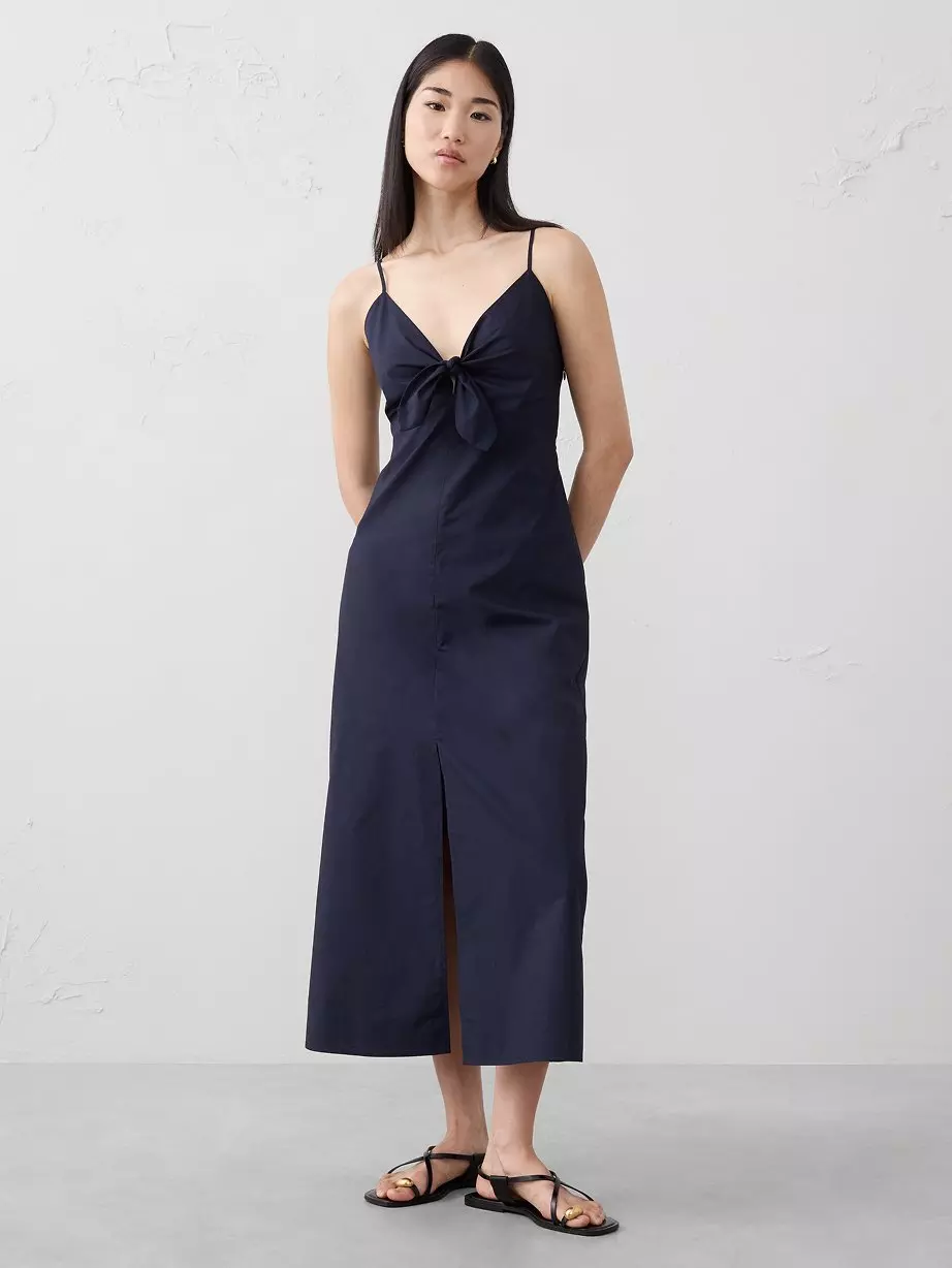 Women in navy dress. 