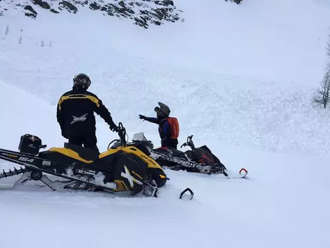 snowmobiler saved by avalanche airbag nearly leaving behind