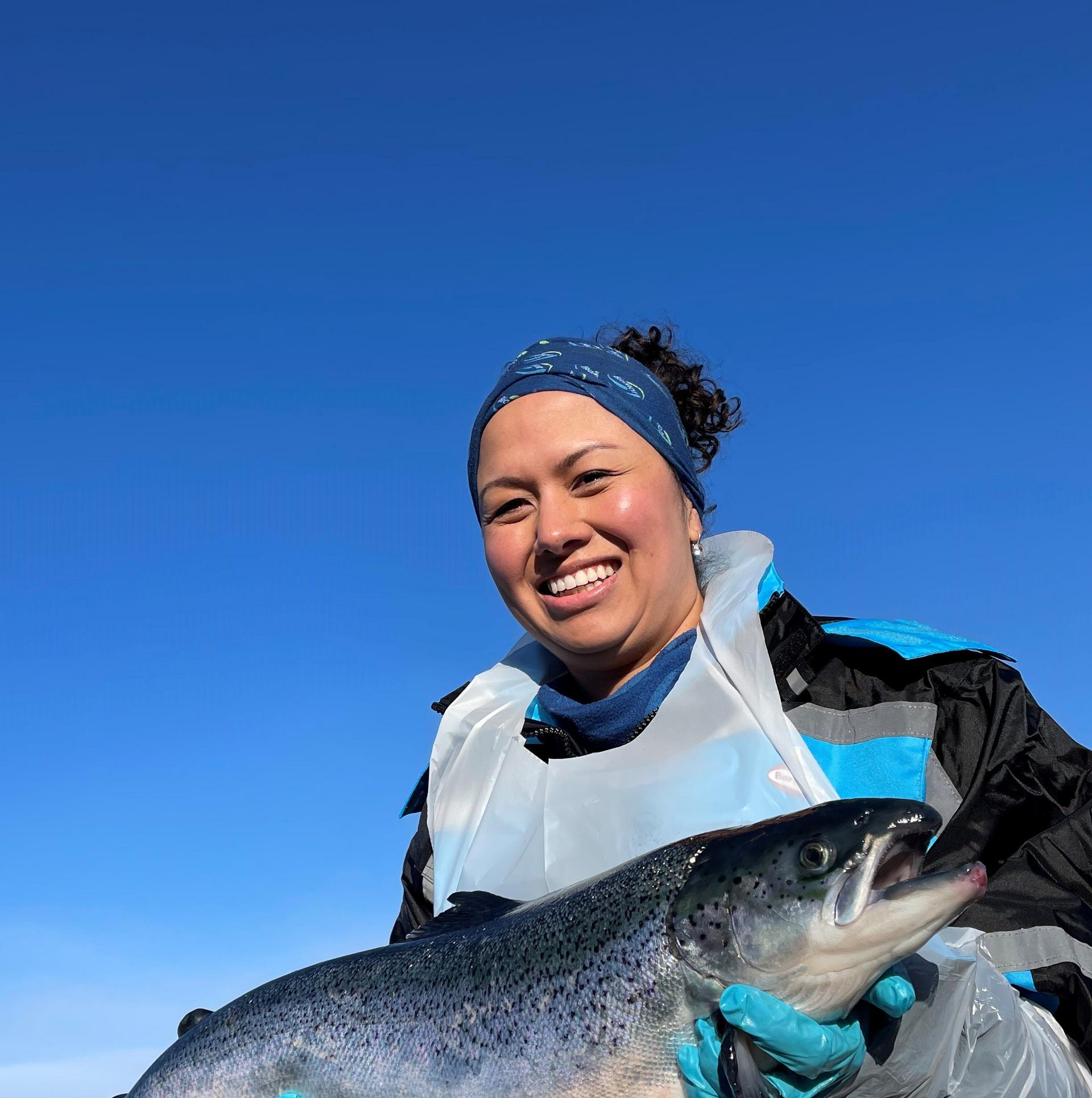 woman holding a fish