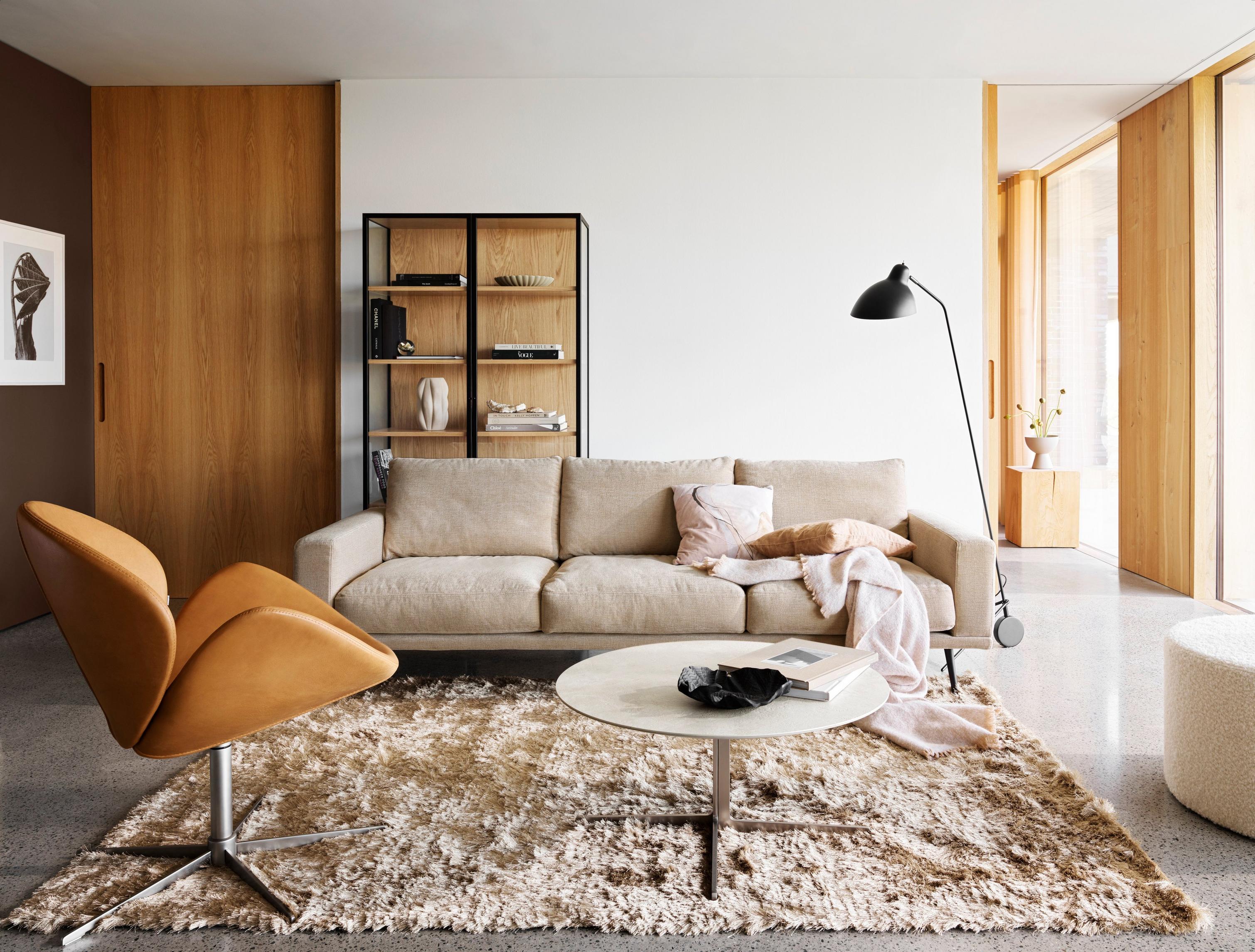 The Carlton sofa in beige Tomelilla fabric and the Sevilla coffee table.