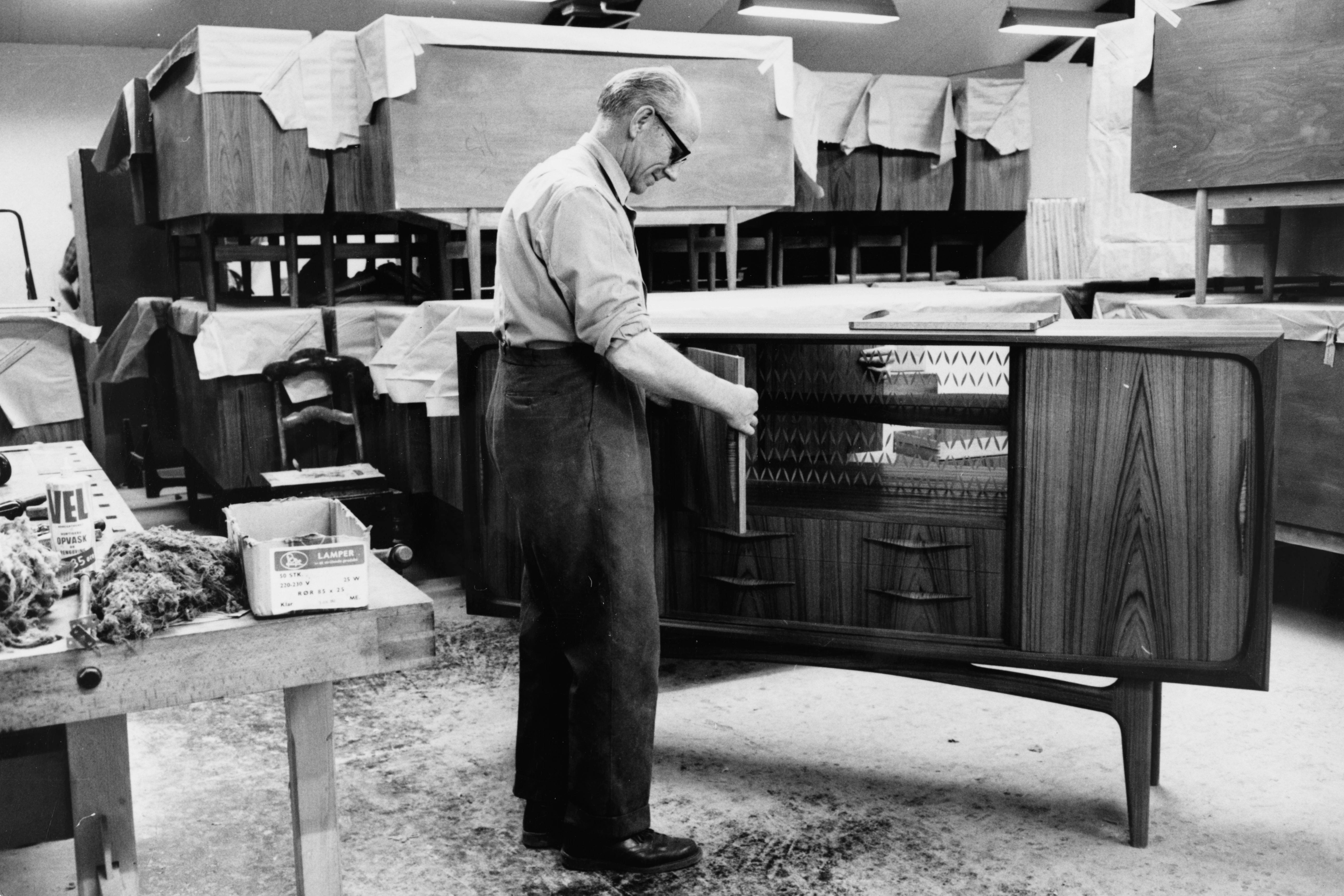 Black and white image of old cabinet and man from BoConcept 