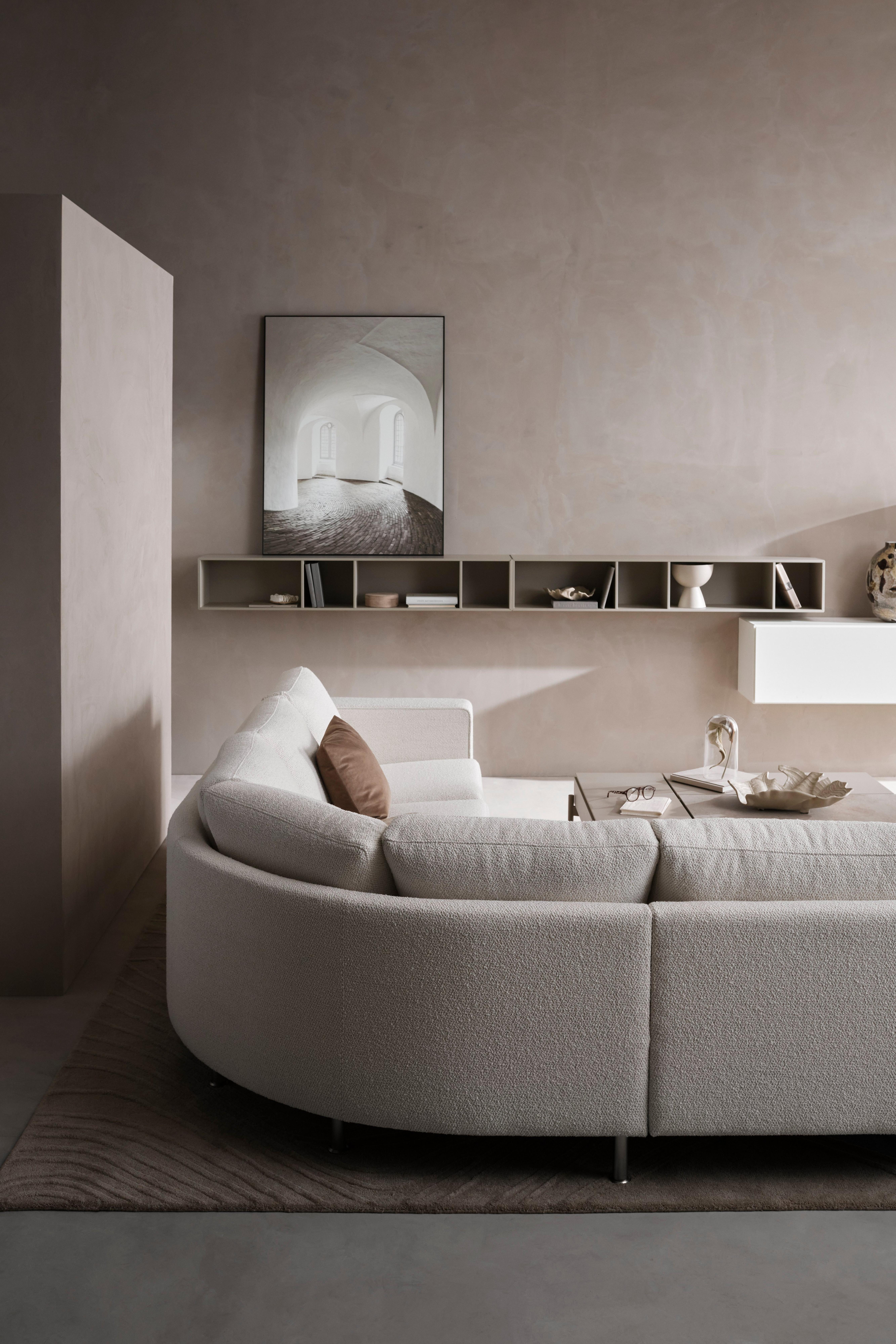 The Indivi corner sofa shown in a small space room.