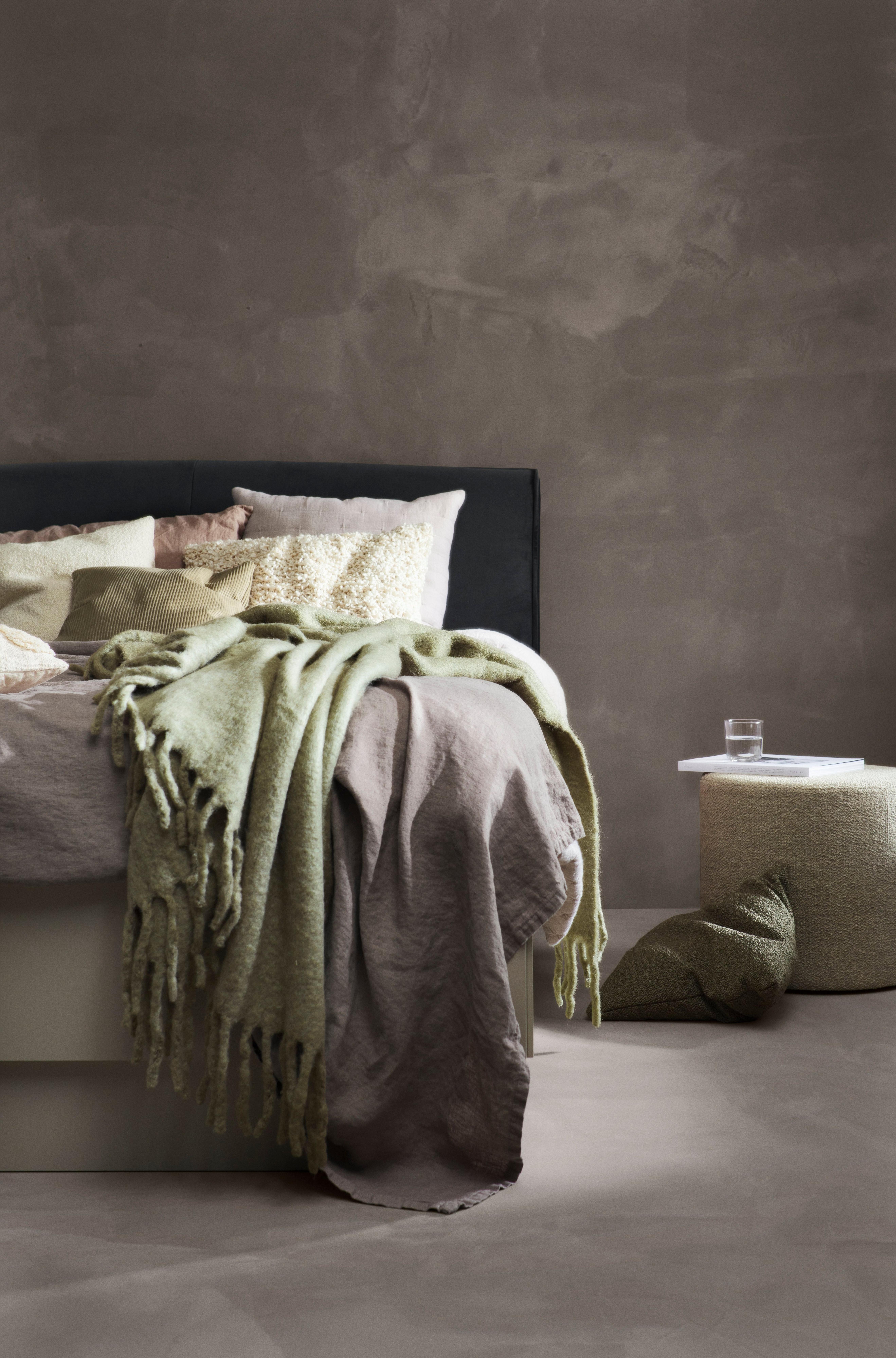 Throwns and bedspreads styled on bed