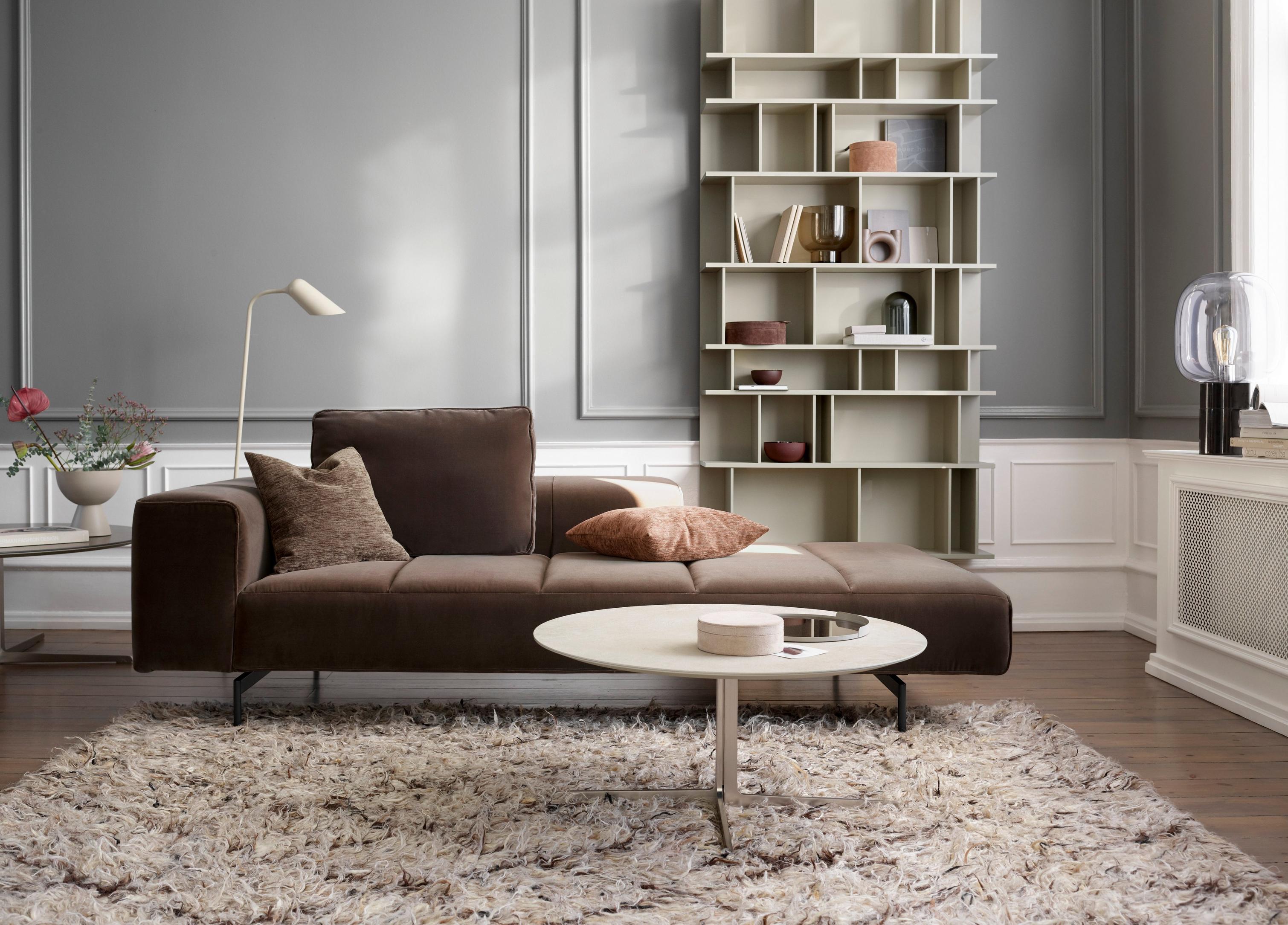 The Amsterdam Iounging sofa in a living room with the Como wall system.