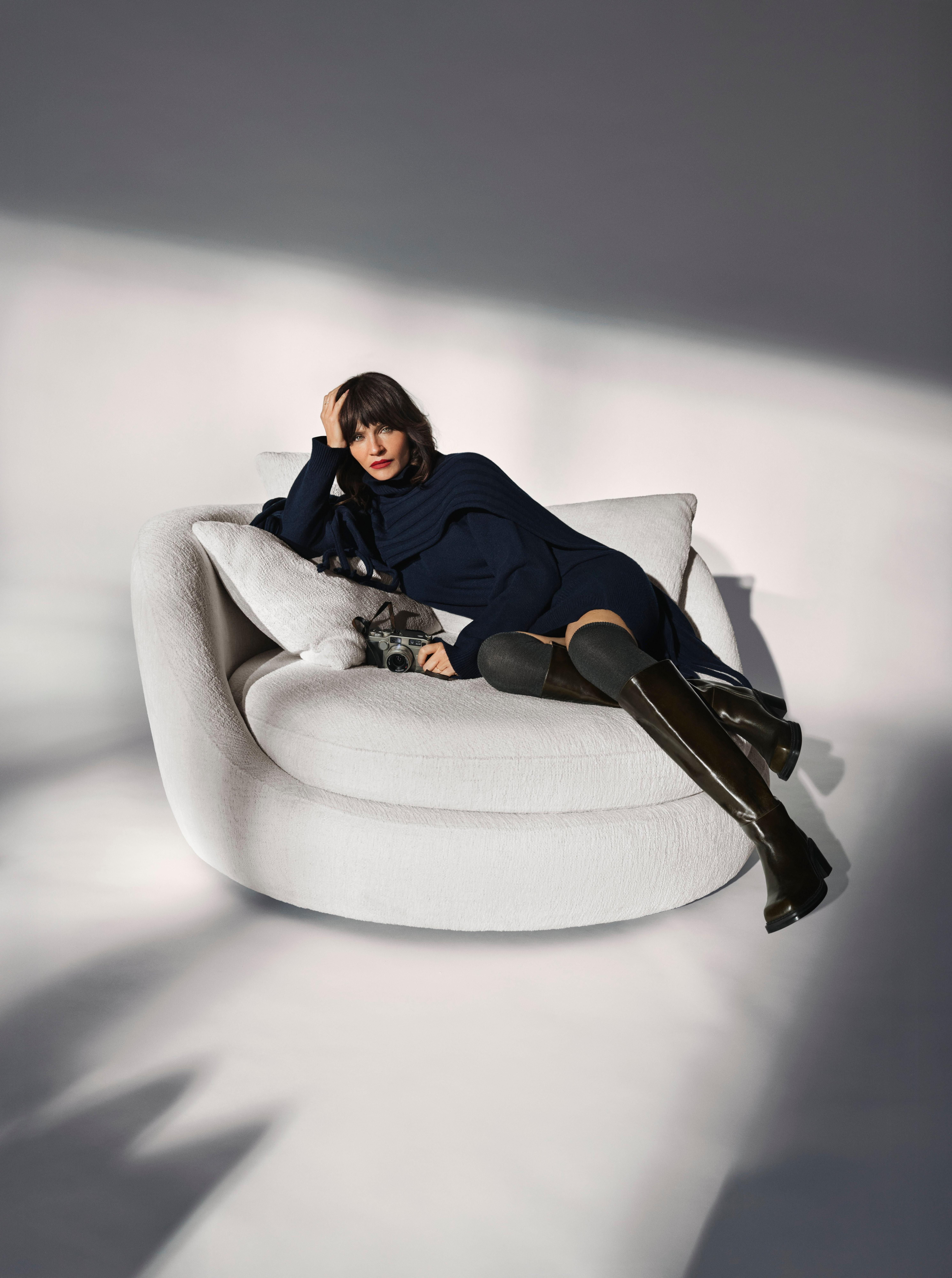 Ø lounge chair in white Lucca fabric, featuring a sculptural, circular design with plush cushioning for a modern yet cozy statement piece.