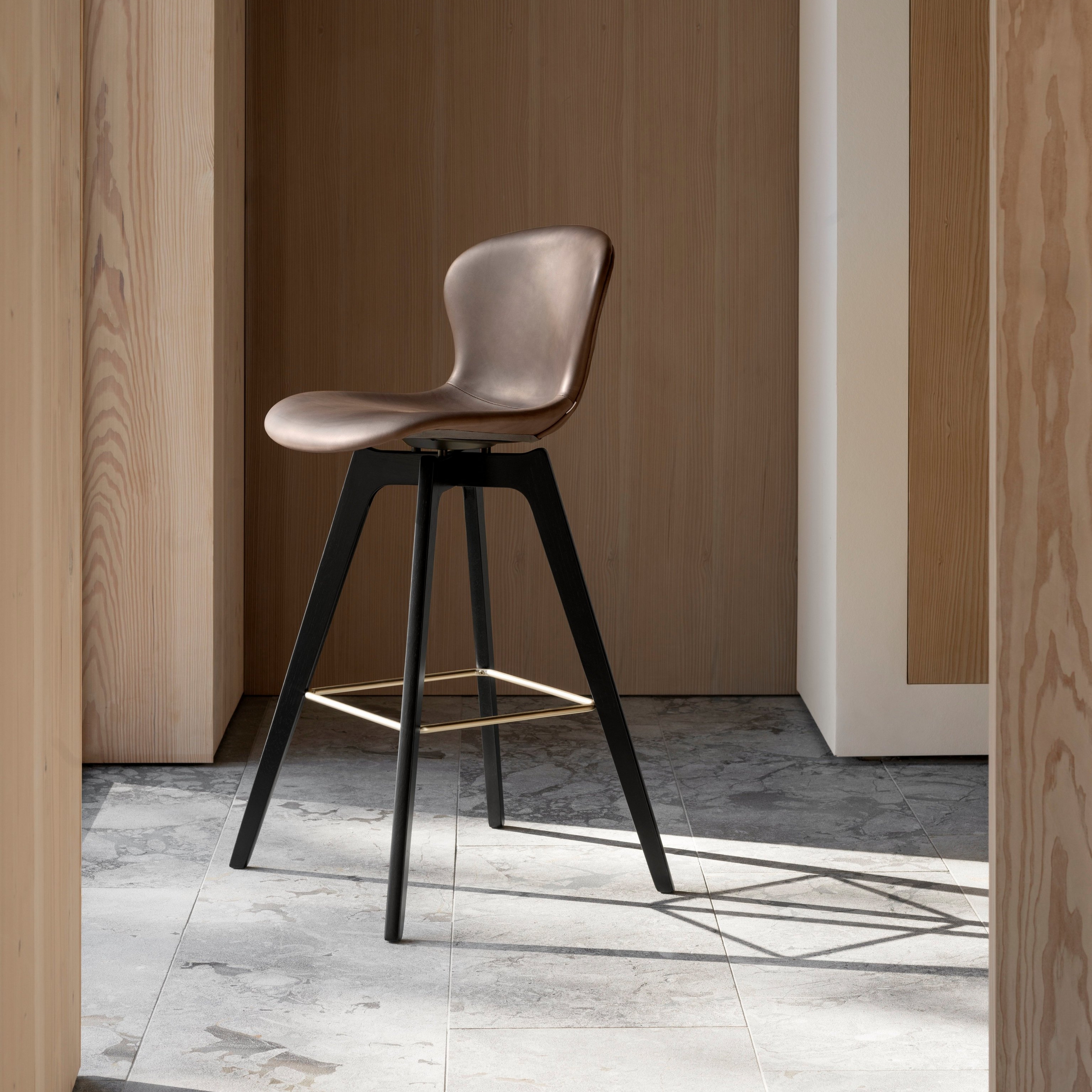 Adelaide bar stool placed in an open room