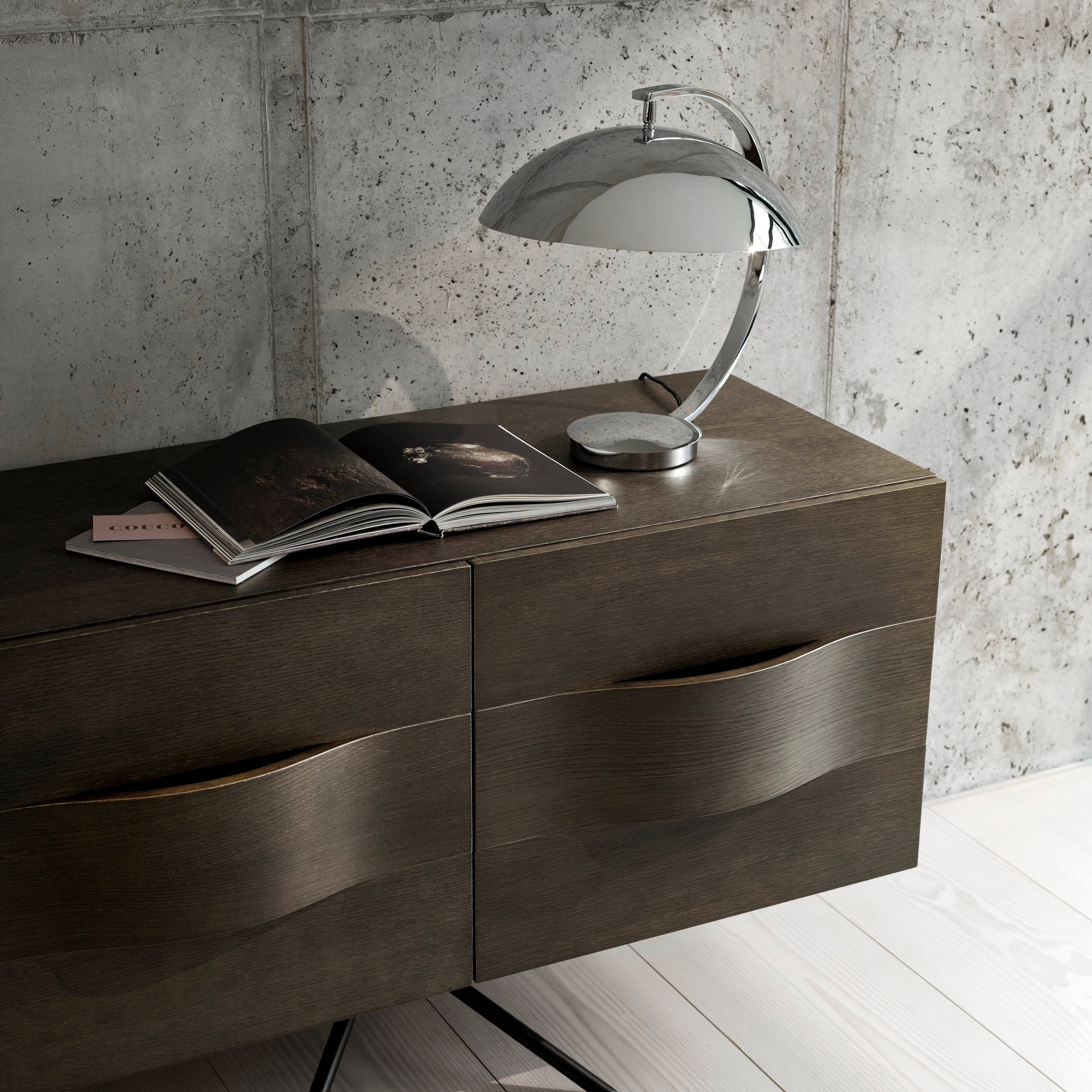 Close up of the Ottawa sideboard in dark oak veneer styled with table lamp in chrome.