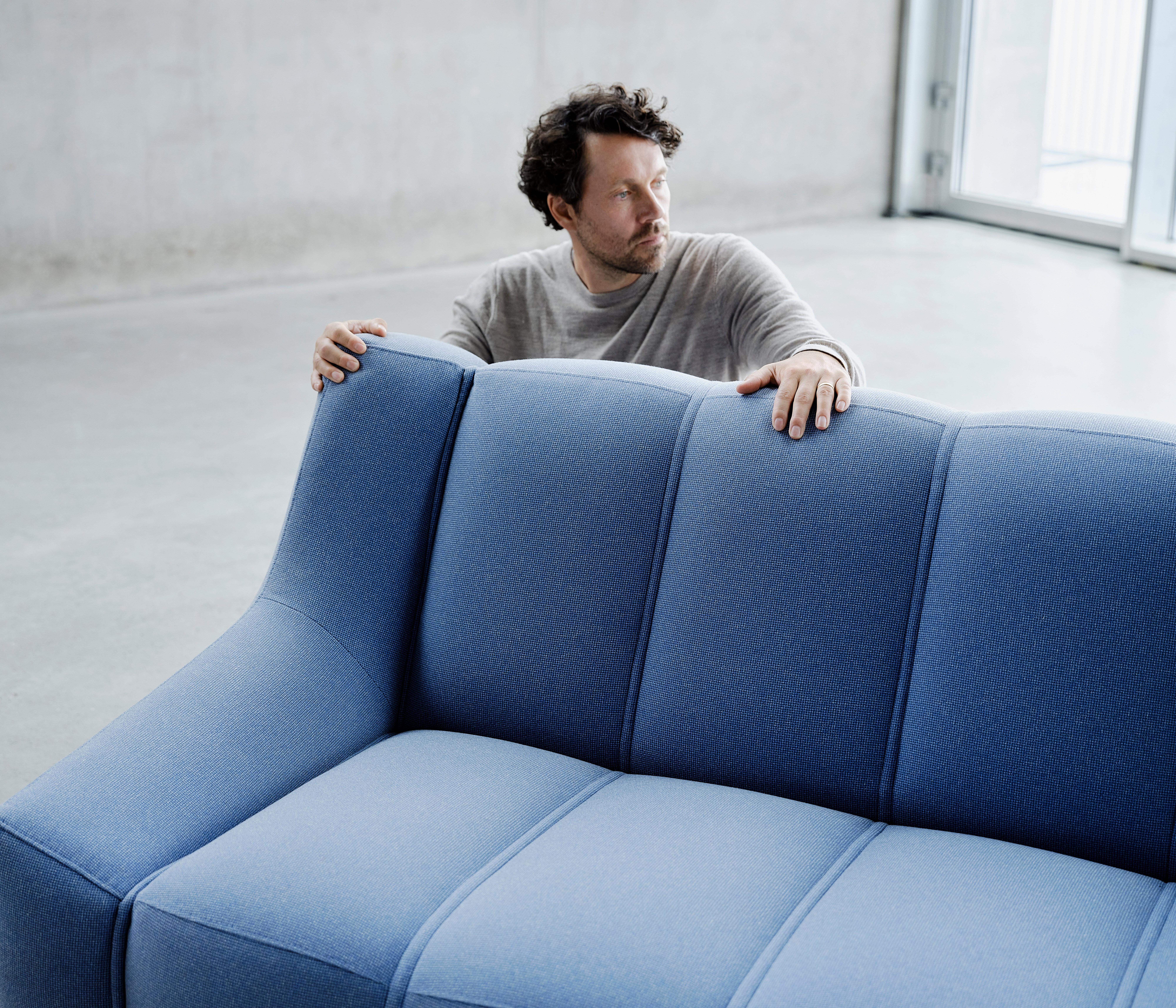 Jakob Lange from BIG looking at the Nawabari sofa