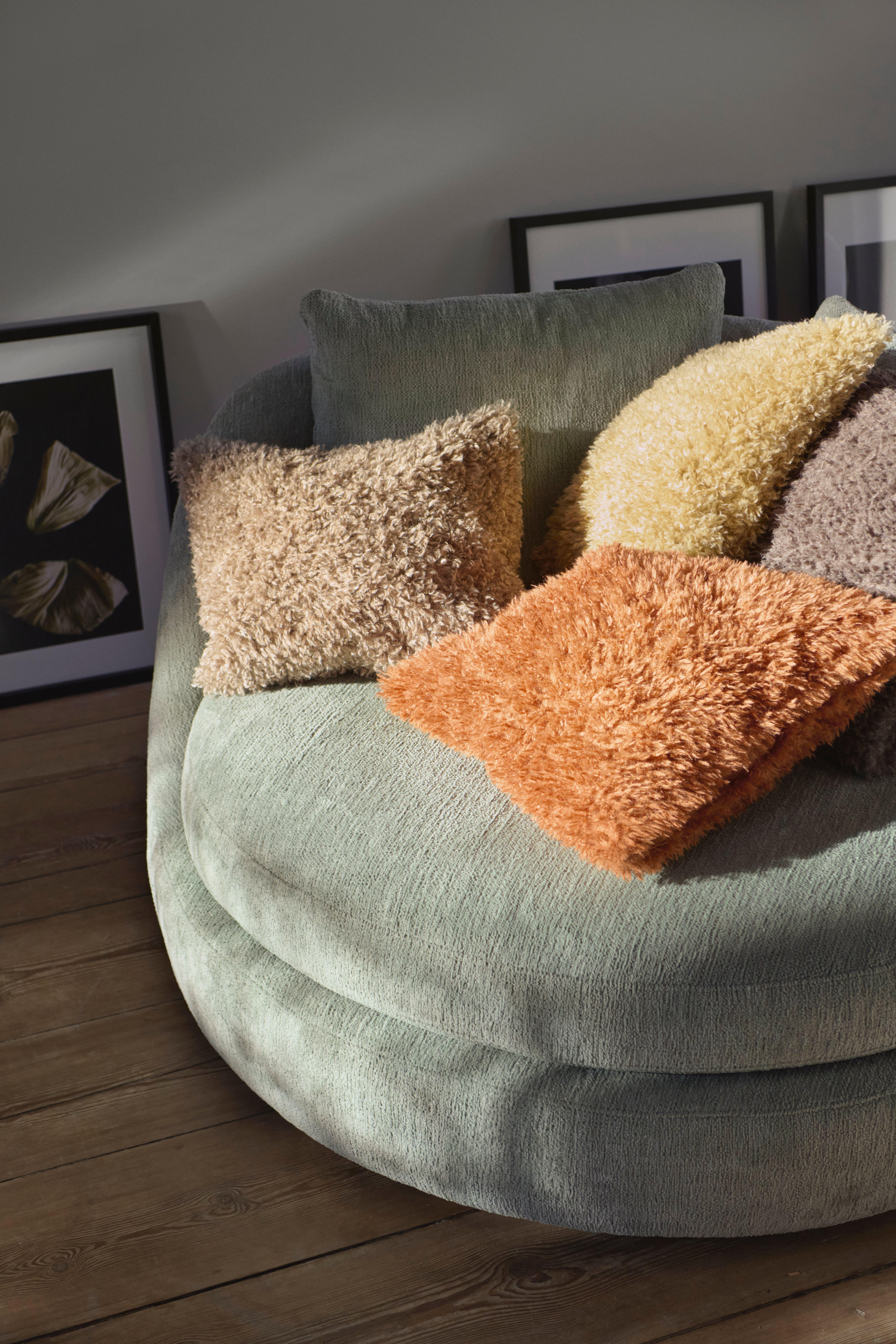 Helena Christensen on Ø lounge chair in Lucca fabric