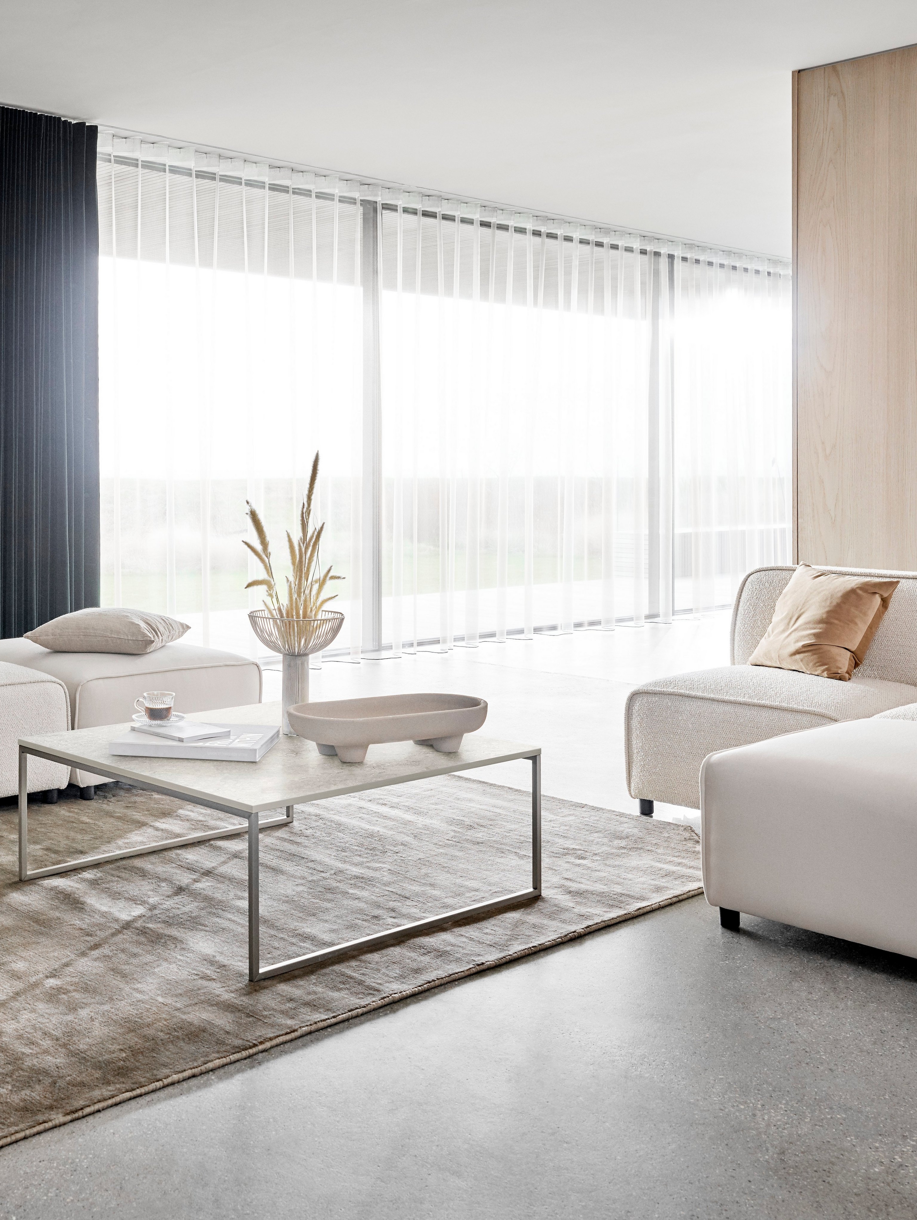 Carmo sofa with lounging unit, Carmo foot stool in a white Lazio fabric with the Lugo coffee table