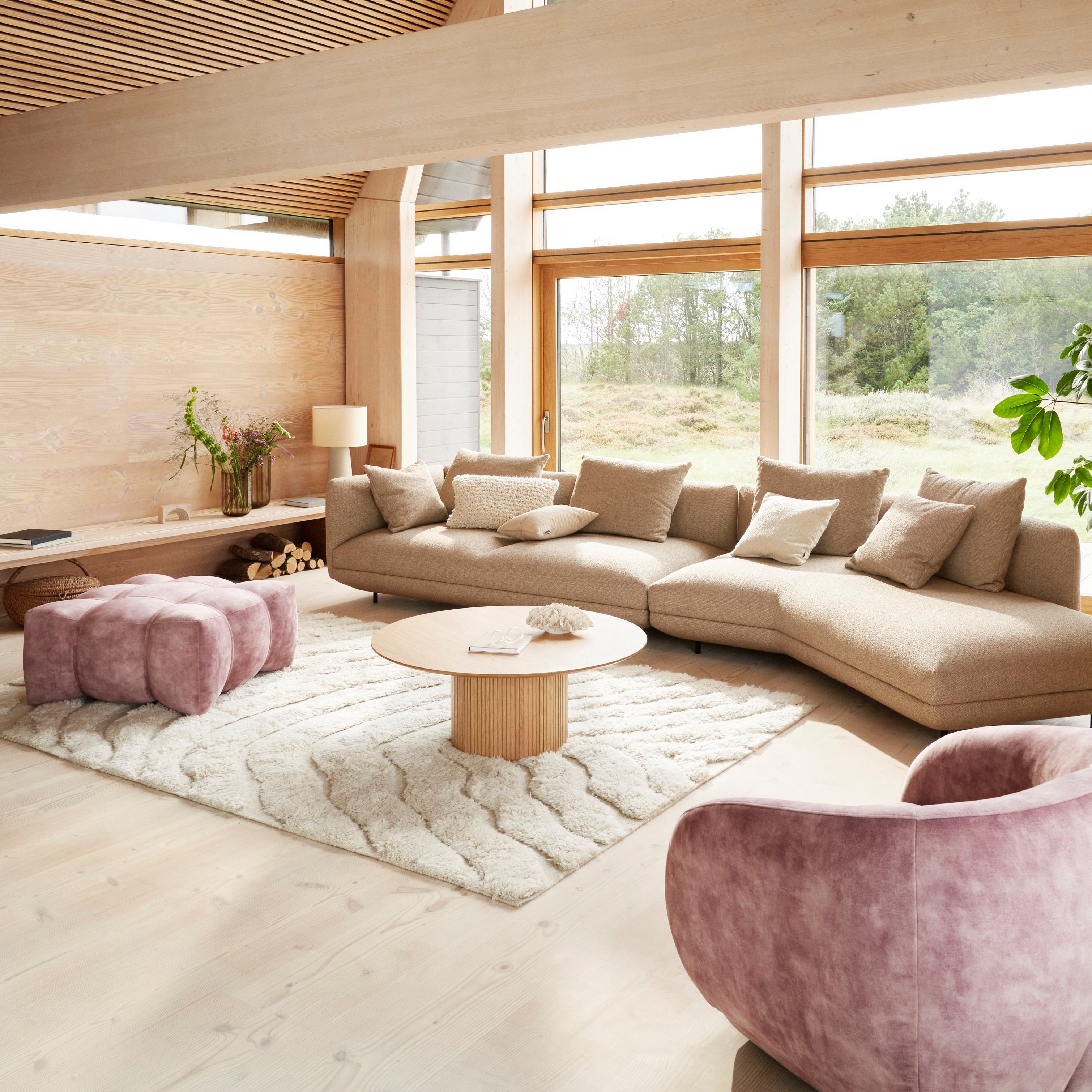 A cozy, modern living room in an A-frame home featuring the Salamanca sofa upholstered in brown Lazio fabric.