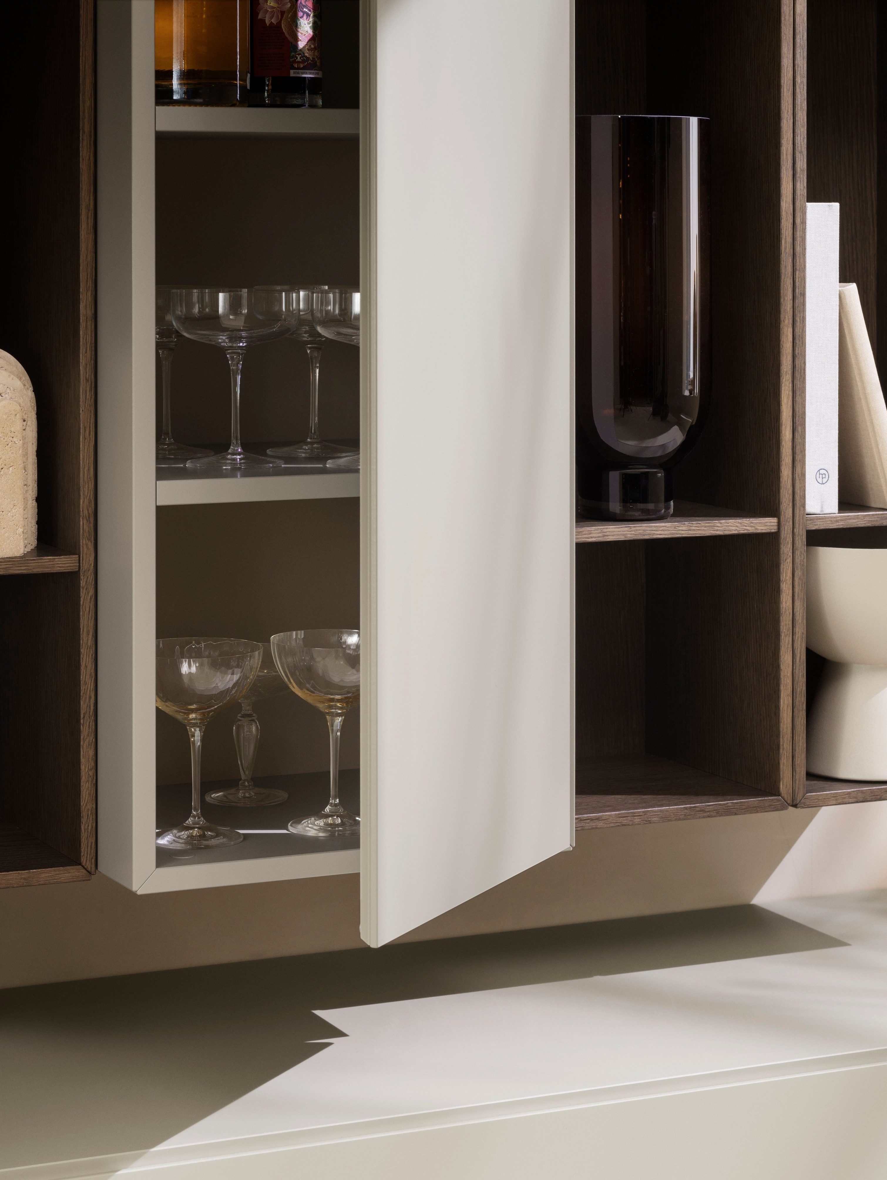 Smart storage display with books, vases, sculptures and more.