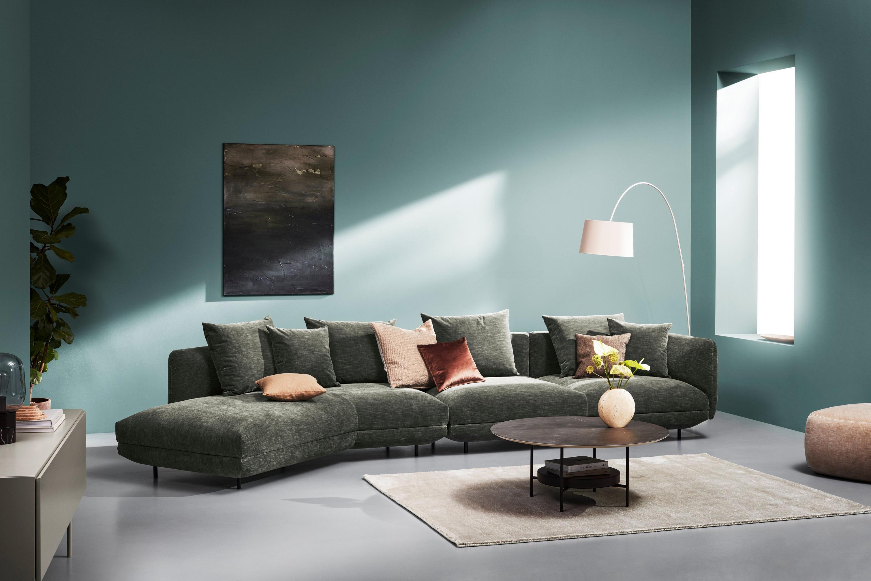 A colorful living space featuring the Salamanca sofa and the Madrid coffee table.