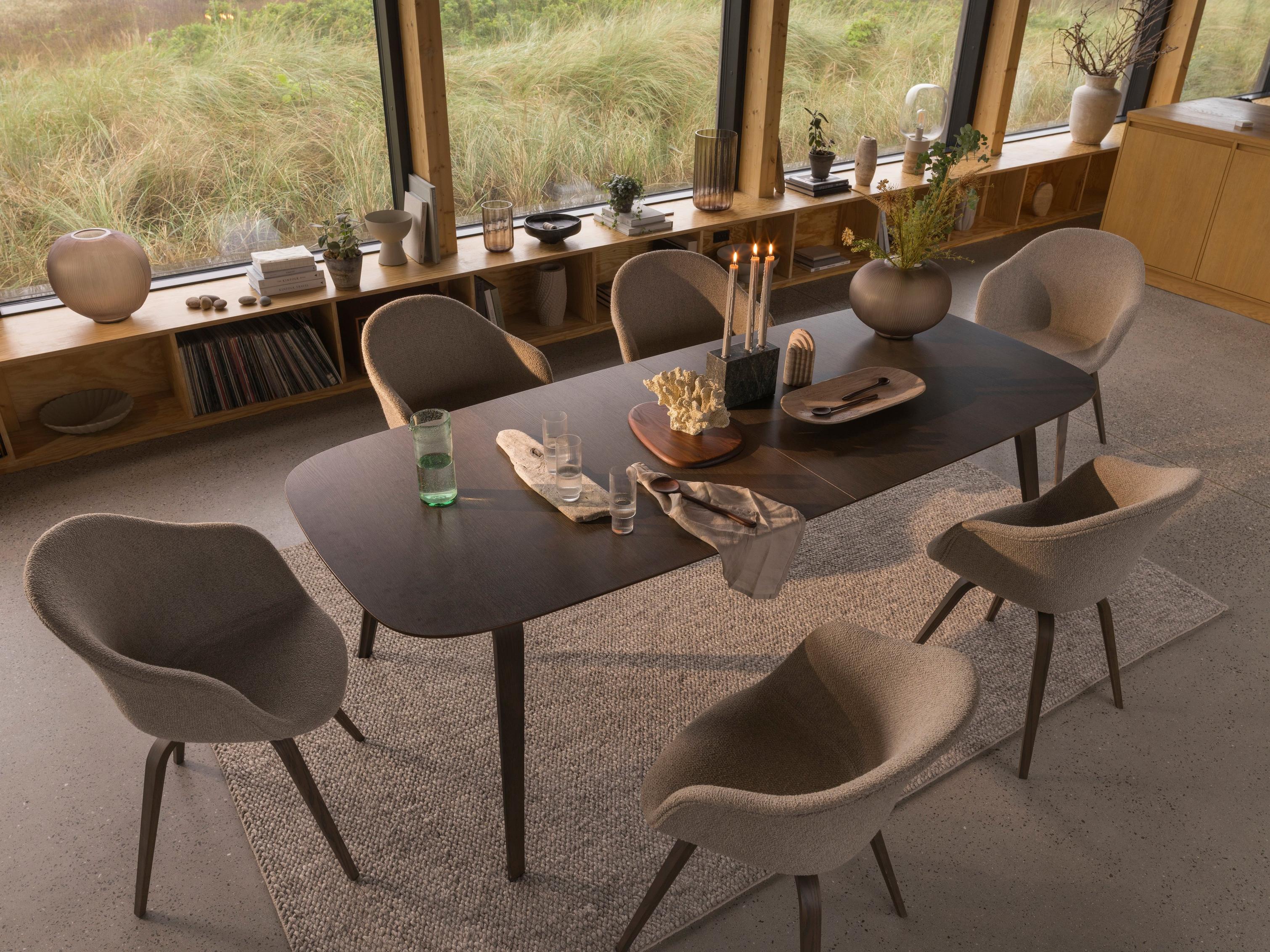 An organic dining setting with natural elements featuring the Hauge dining table and dining chairs.
