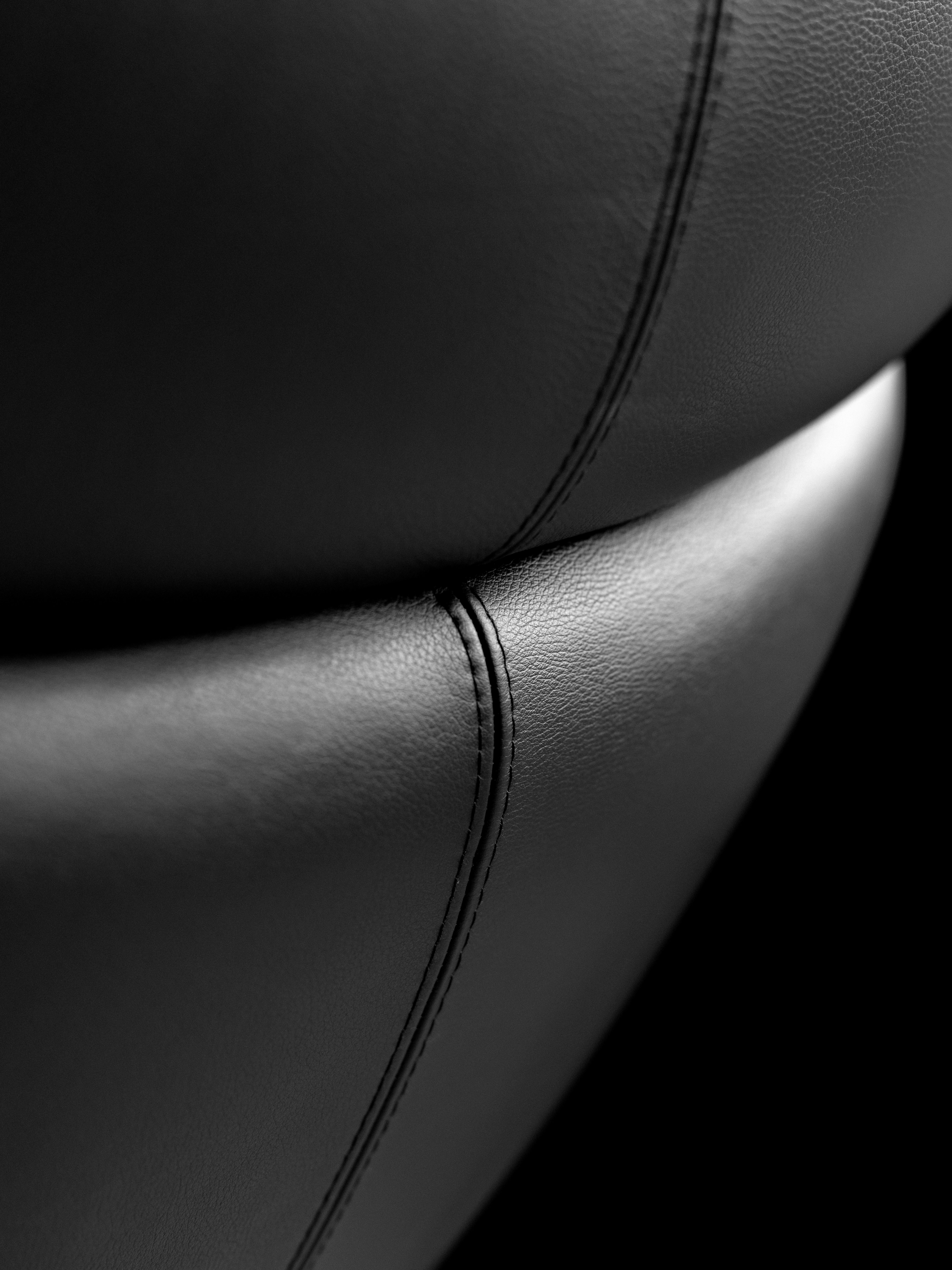 Sideboard with drawer section in dark oak veneer, styled with a forest green Curve bowl on top, adding contrast and texture to the sleek wood finish.