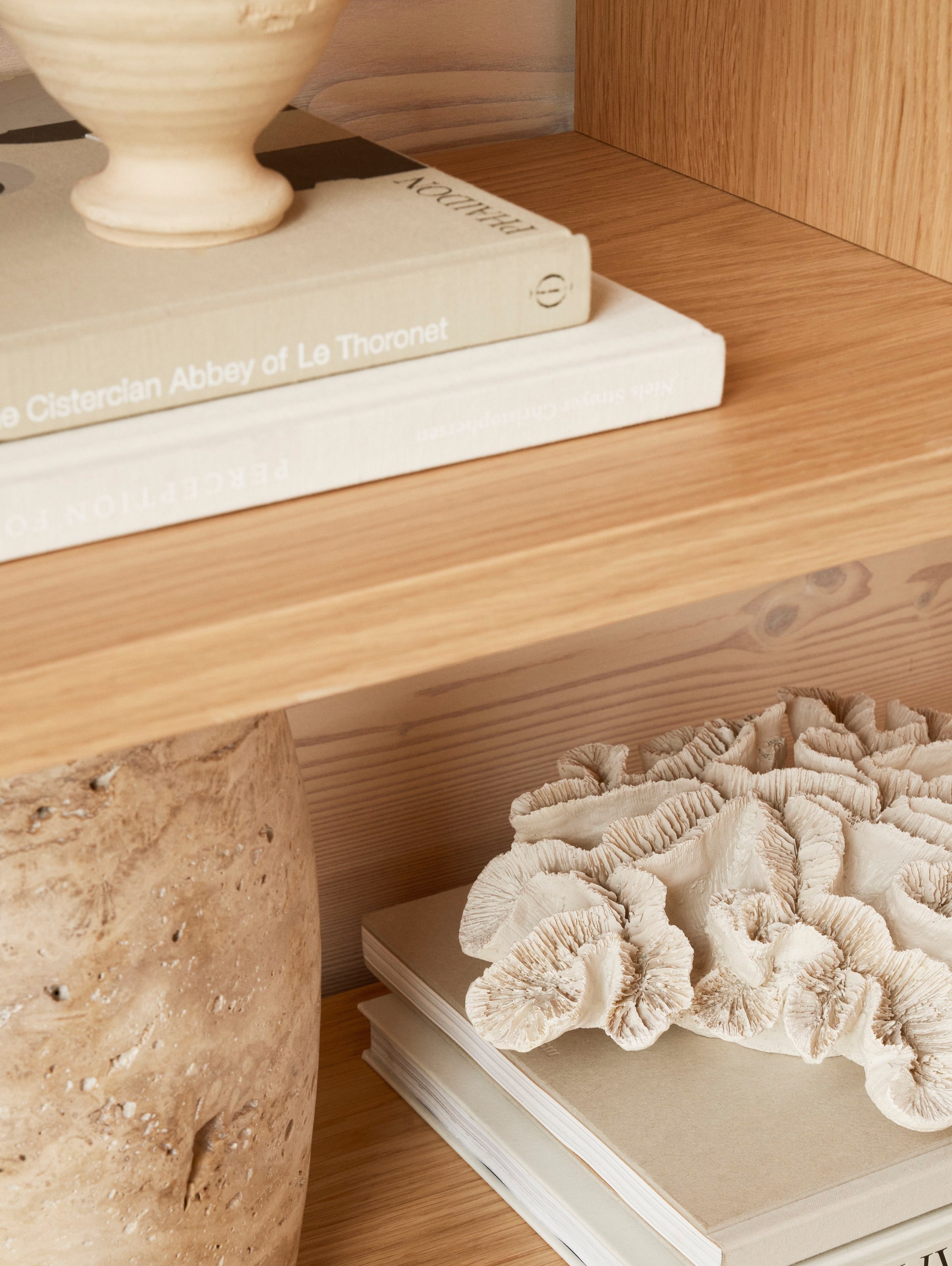 A close-up look at the accessories on the Calgary storage system in Natural Oak