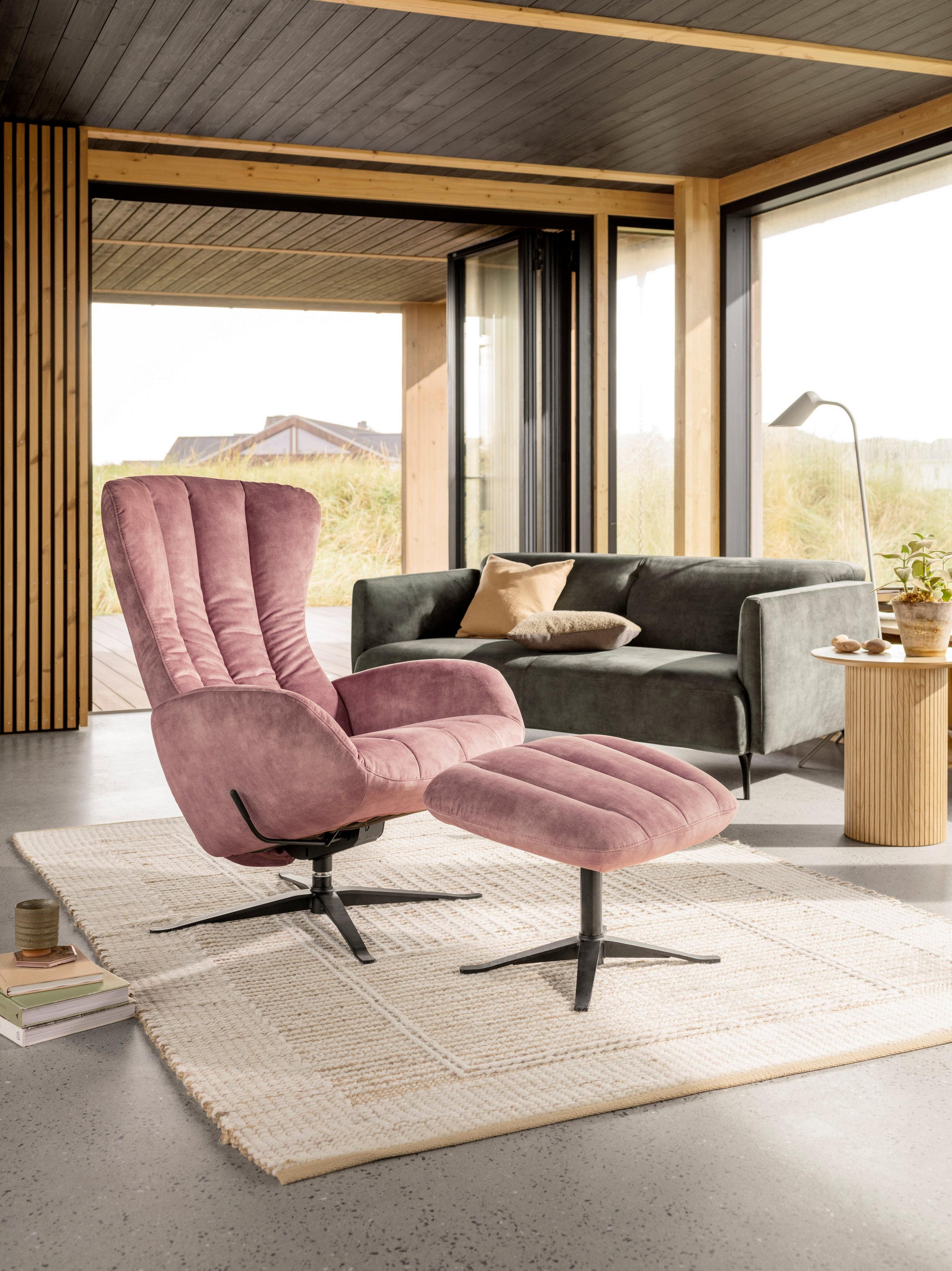 Light-filled living space featuring the Tilburg living chair and matching foot stool in dusty rose Ravello fabric.