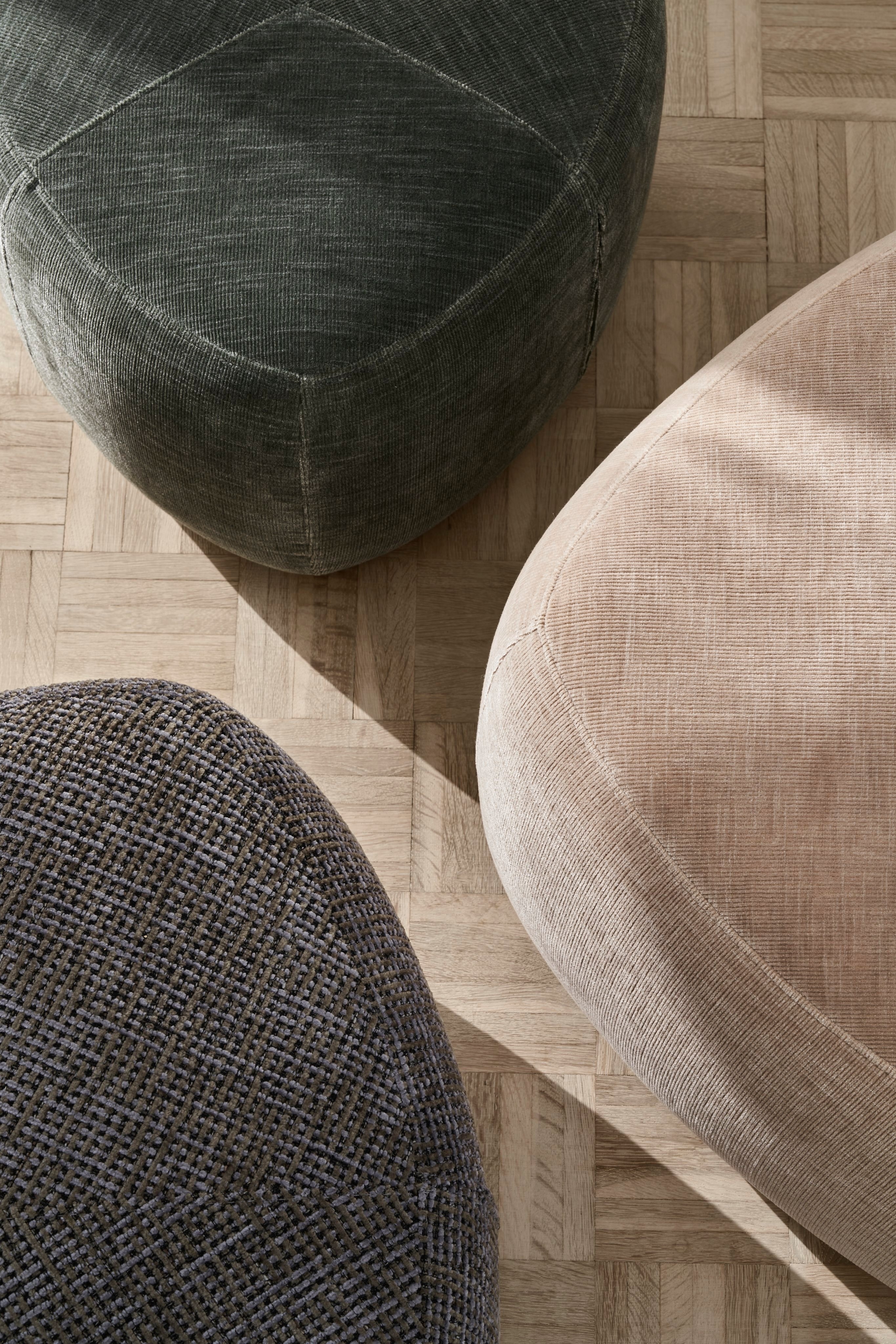 Textured bouclé fabric draped over an object with a soft, plush appearance