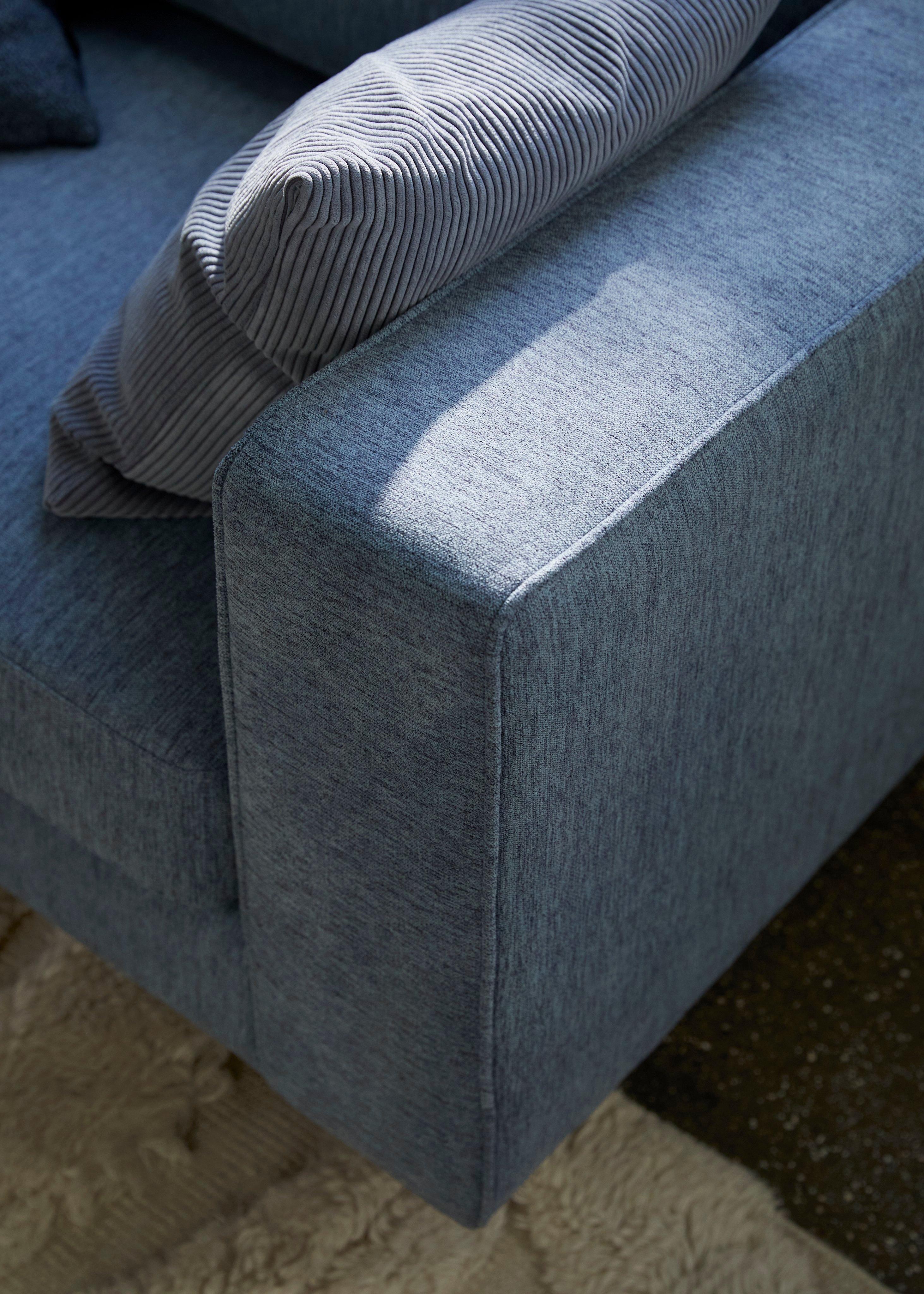 Close up of the Indivi sofa in blue Capri fabric