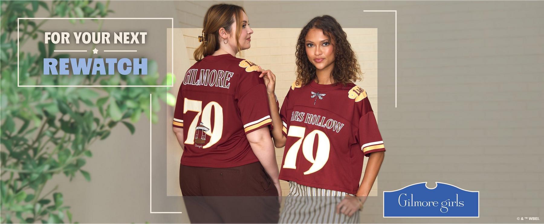 Two models wearing maroon Gilmore Girls jerseys with "Stars Hollow 79" on the front and "Gilmore Girls 79" on the back view. Shop Now.