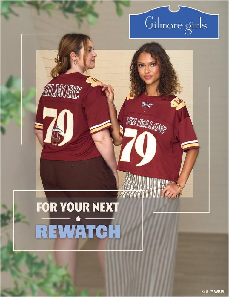 Two models wearing maroon Gilmore Girls jerseys with "Stars Hollow 79" on the front and "Gilmore Girls 79" on the back view. Shop Now.