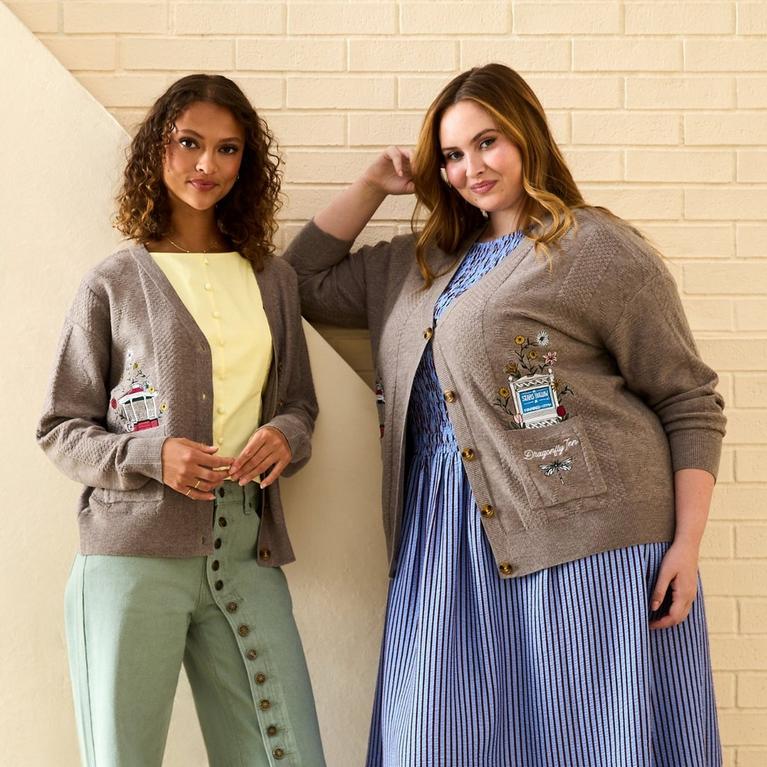 Two models wearing button-front cardigans with embroidered details. Shop Now.