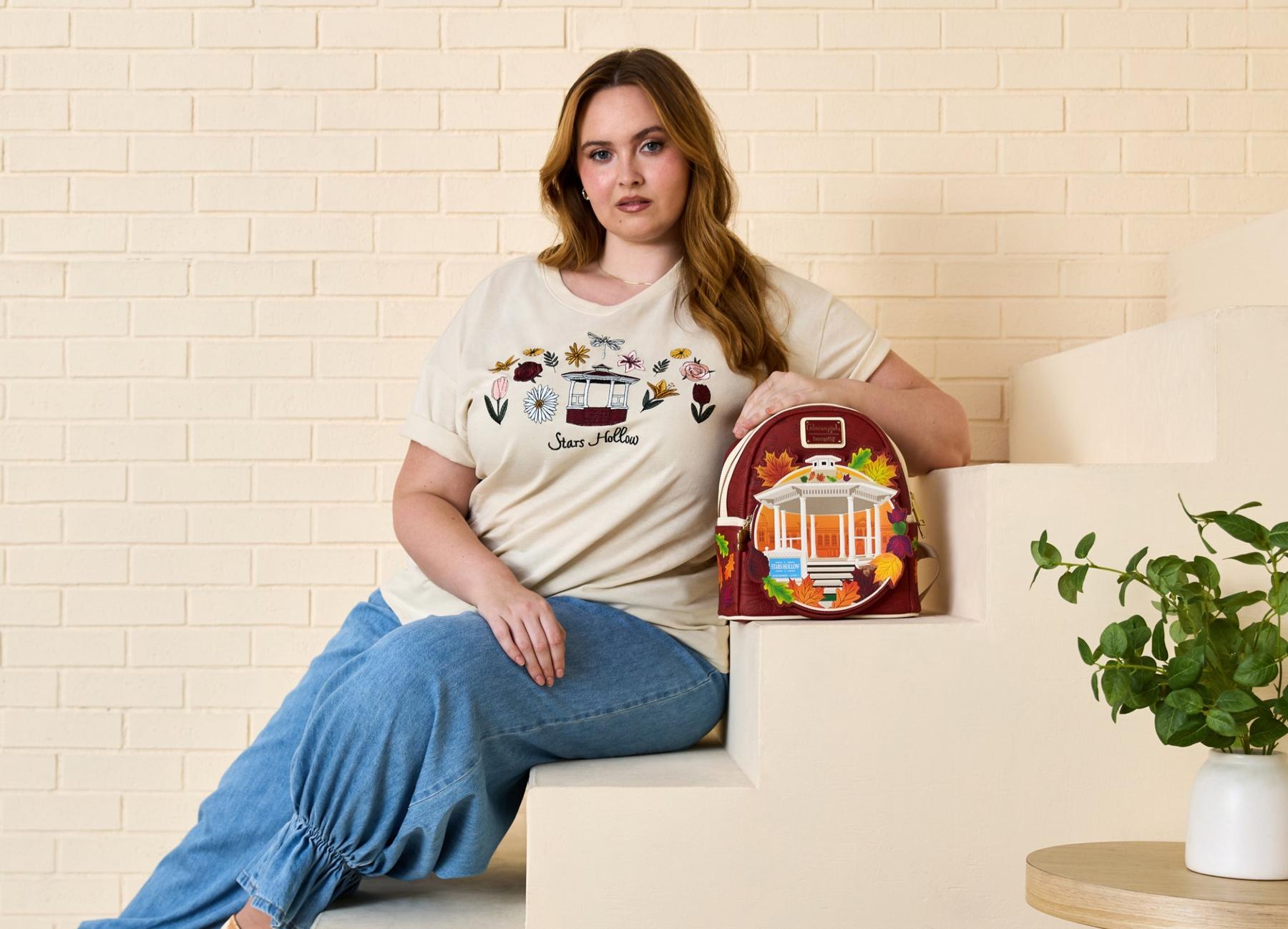 Two models wearing button-front cardigans with embroidered details. Shop Now.