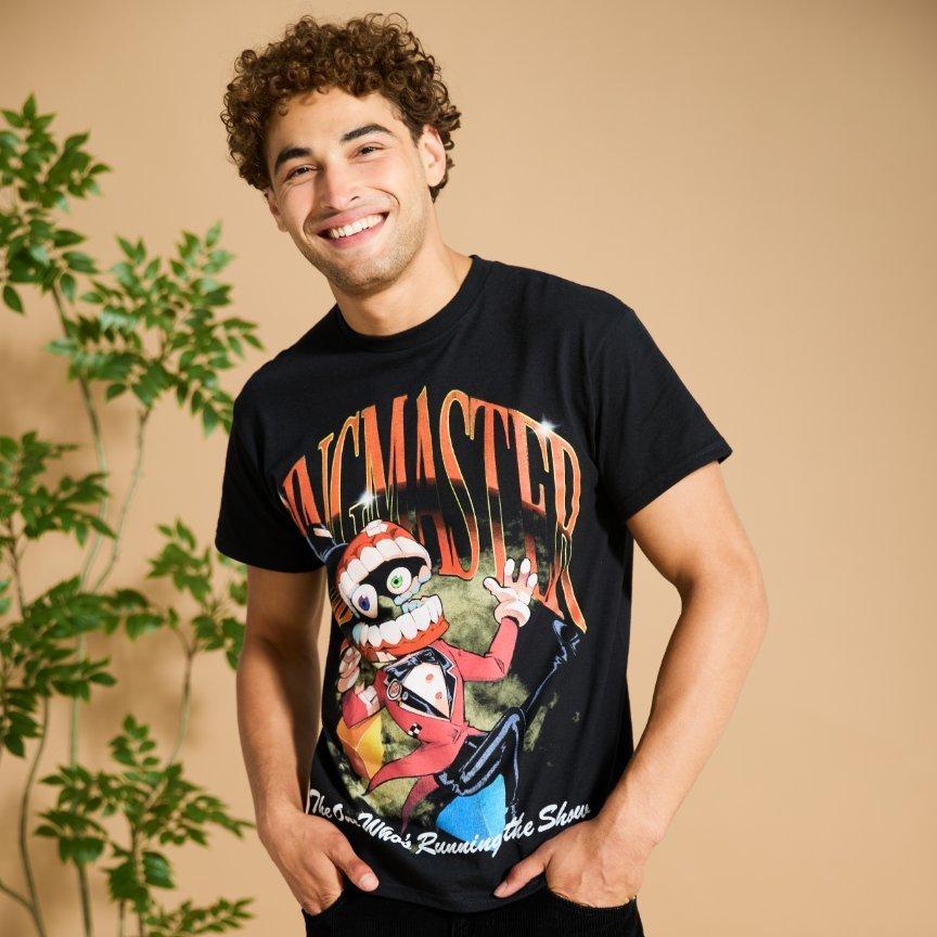 Male model wearing black “RINGMASTER” graphic T-shirt with cartoon character. Shop Now.