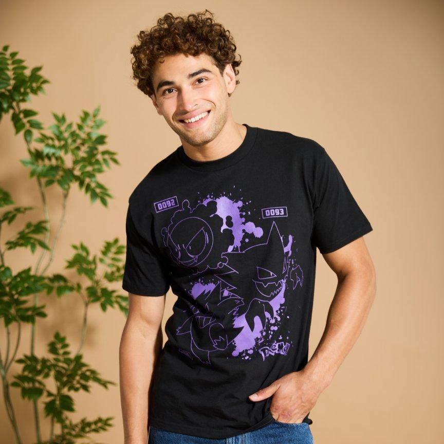 Model wearing black T-shirt with purple graphic Pokemon characters printed. Shop Now.
