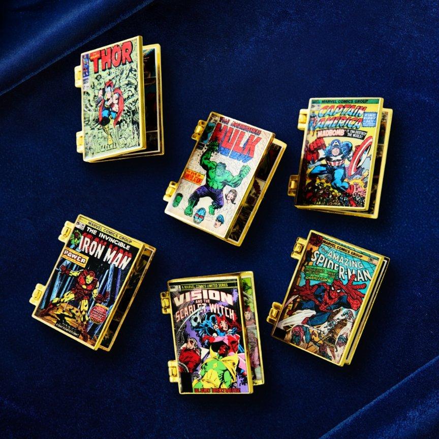 Six gold-tone Marvel comic book cover pins: Thor, Hulk, Captain America, Iron Man, Vision, and Spider-Man. Shop Now.