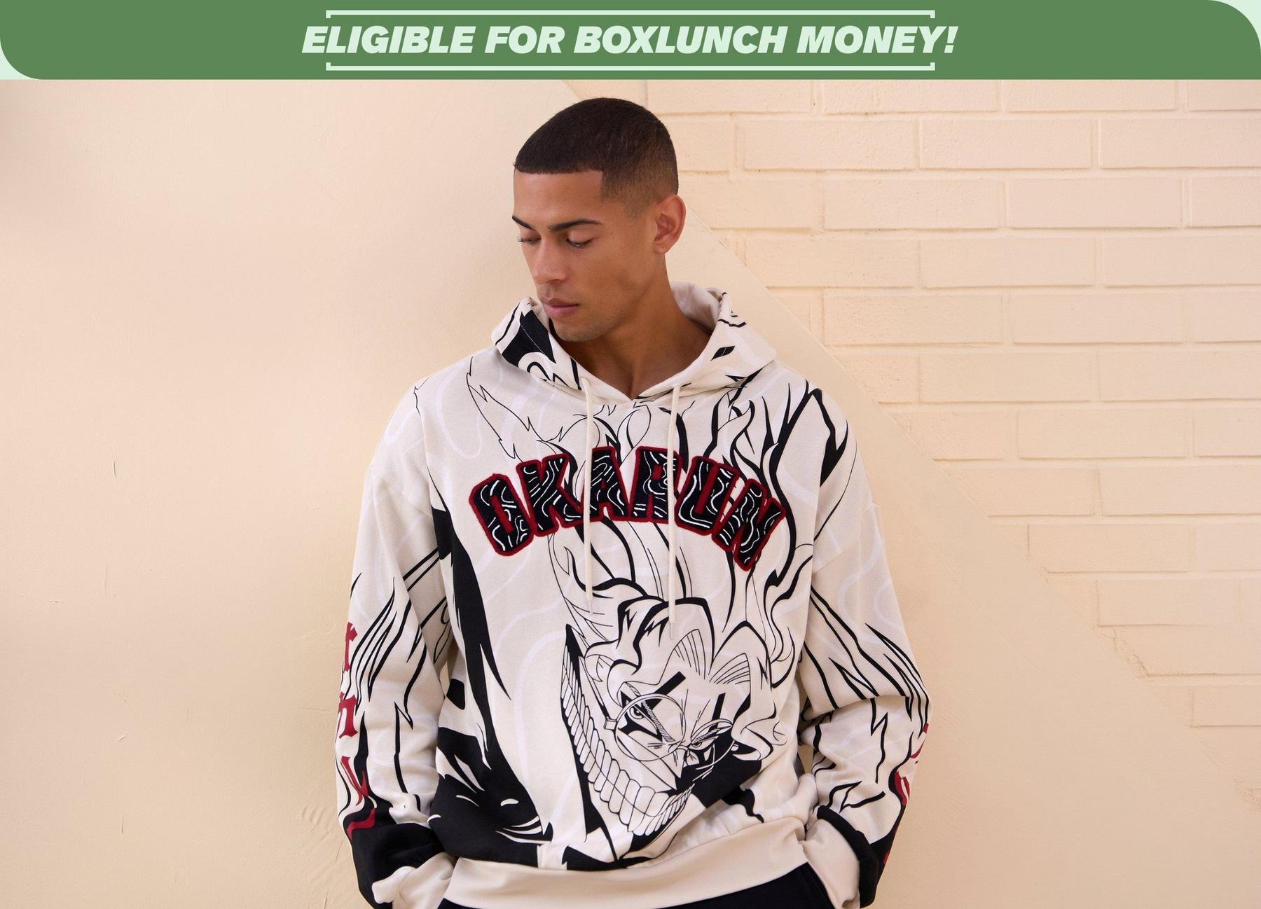  Model wearing a white hoodie with red Okarun lettering and anime character print under “ELIGIBLE FOR BOXLUNCH MONEY!” banner. Shop Now.