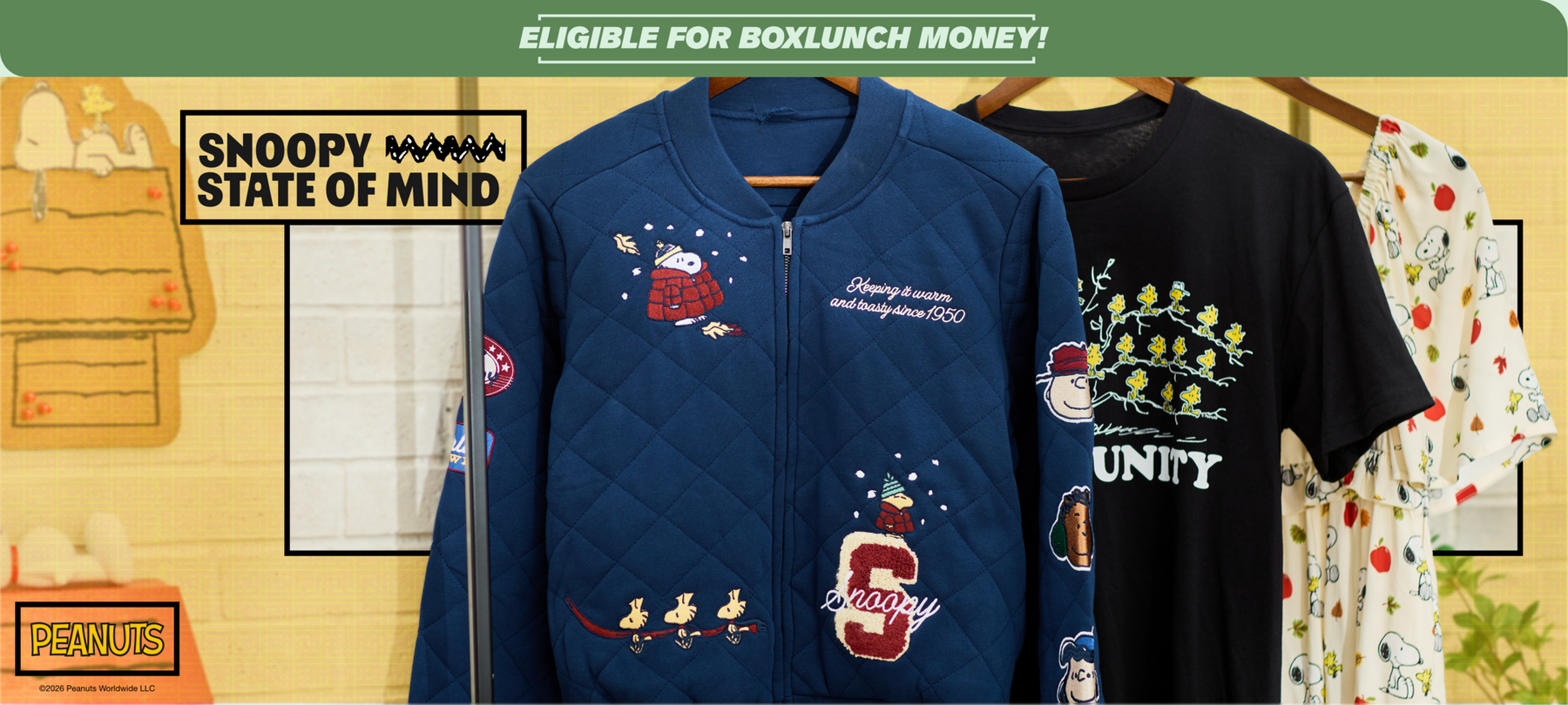 Peanuts apparel on hangers: quilted Snoopy jacket, black graphic T-shirt, and Snoopy print dress. Shop Now.