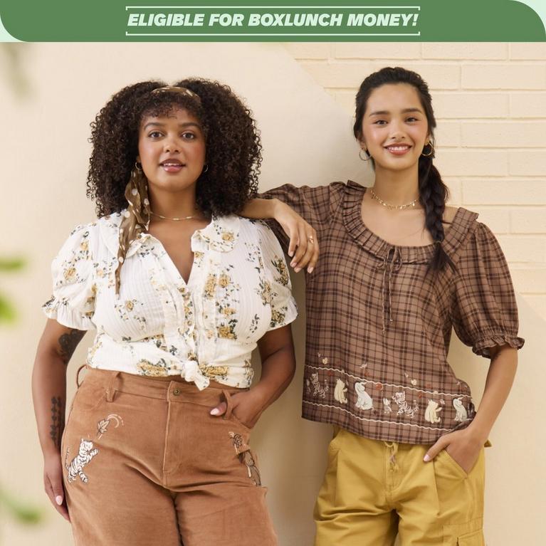 Models wearing brown embroidered Winnie the Pooh pants and a brown plaid Winnie the Pooh blouse under “ELIGIBLE FOR BOXLUNCH MONEY!” banner. Shop Now.