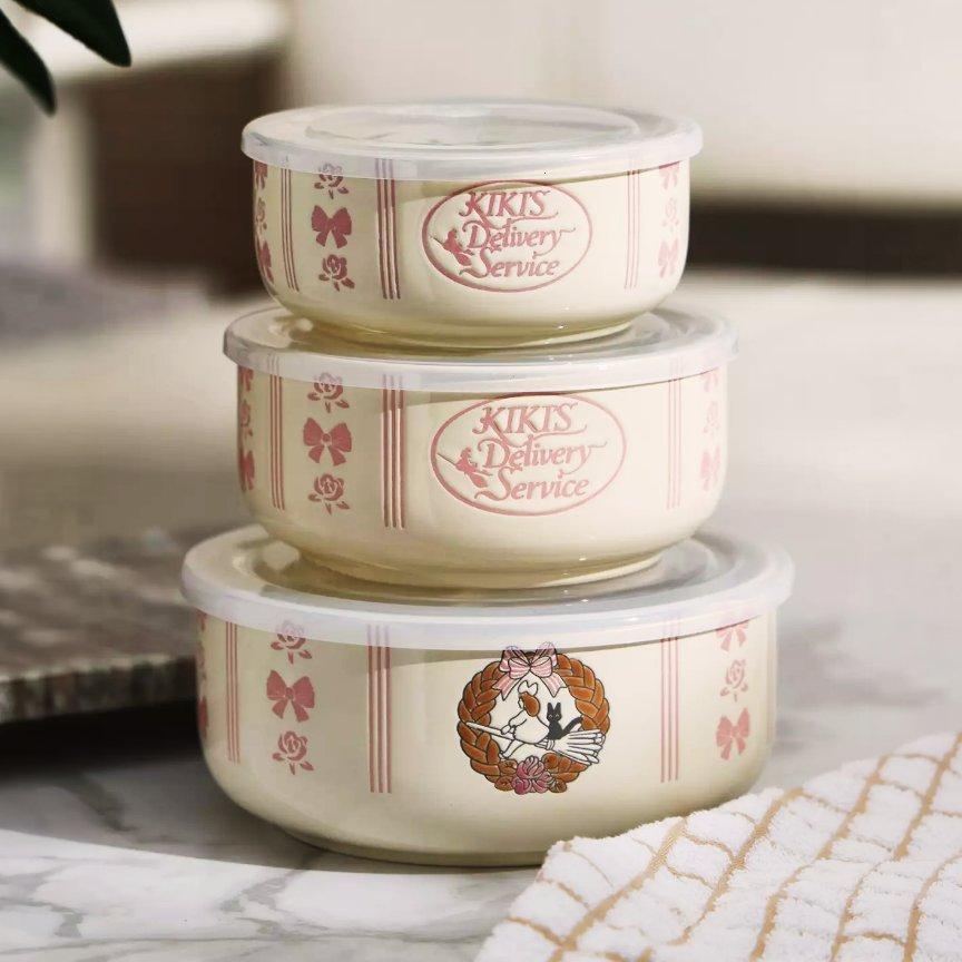 Three Kiki’s Delivery Service food storage bowls with lids stacked. Shop Now.