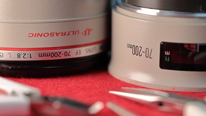 A Male concentrating on a lens repair