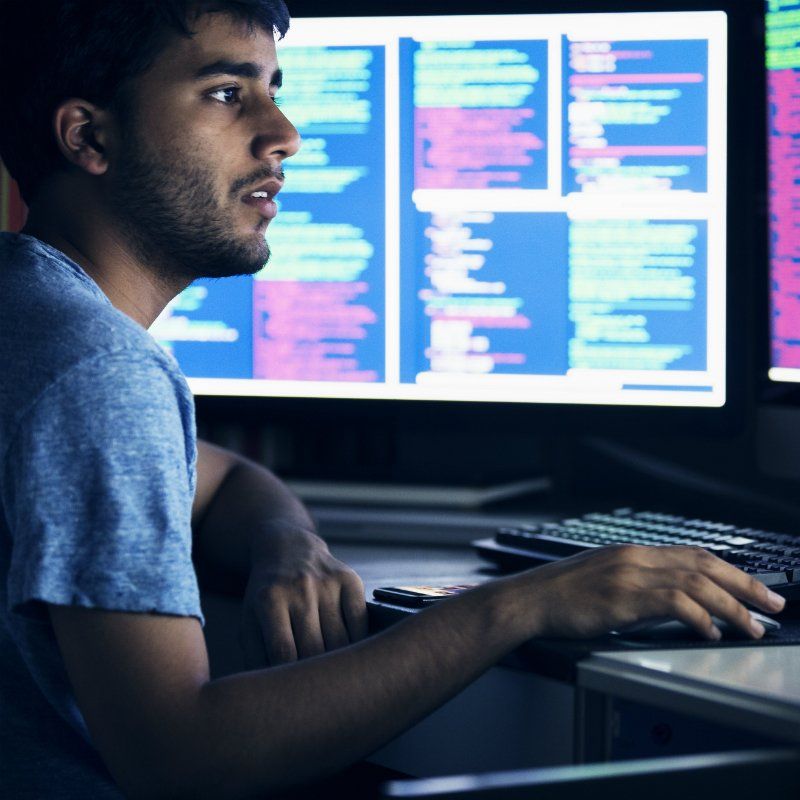Male on computer looking at screen 