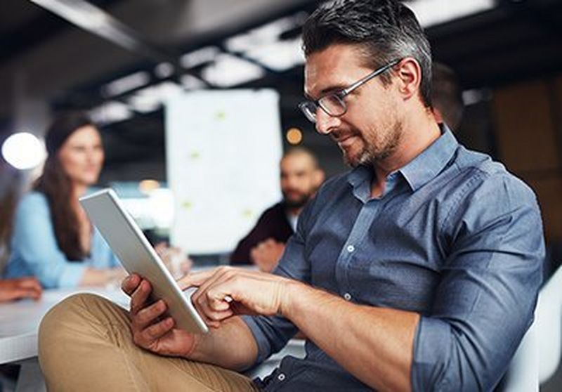 Man looking at tablet