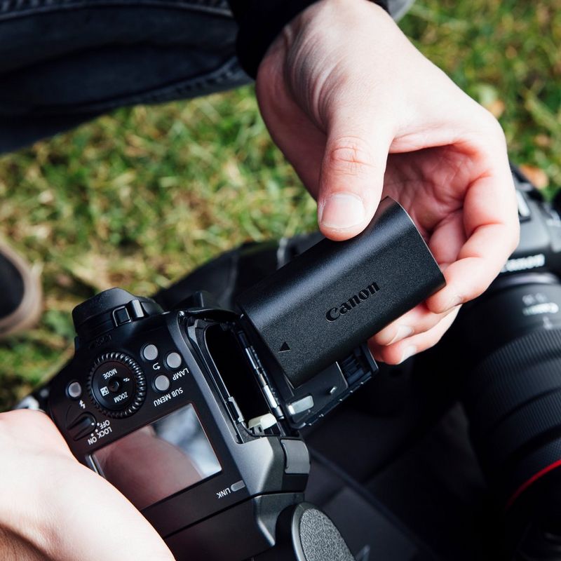 Canon LP-EL Battery Pack 0 Hand putting the battery in a camera