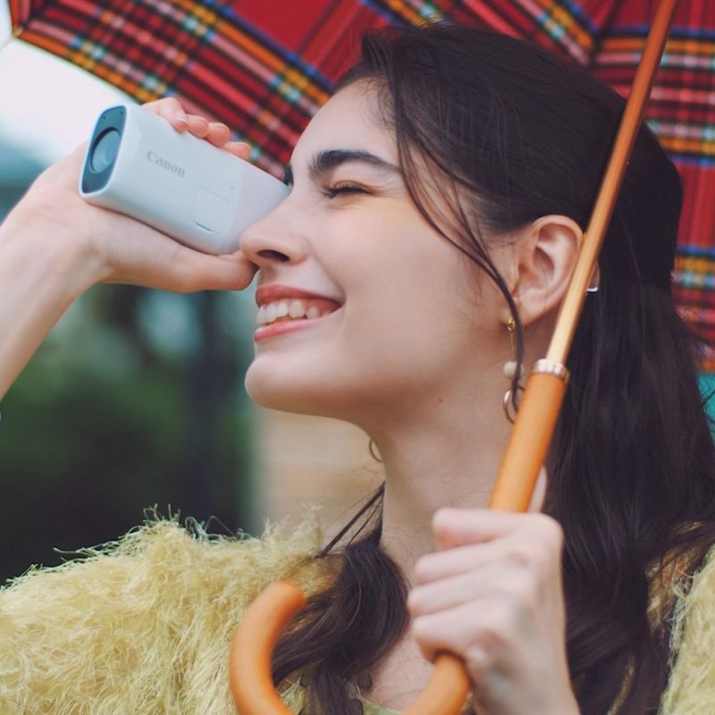 Canon PowerShot ZOOM Telephoto Monocular Compact Camera Essential Kit, Black Woman taking a photo in outdoor