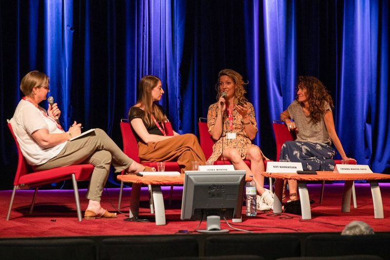 Hilary Roberts, Laura Morton and Catalina Martin-Chico look on as Ilvy Njiokiktjien speaks.