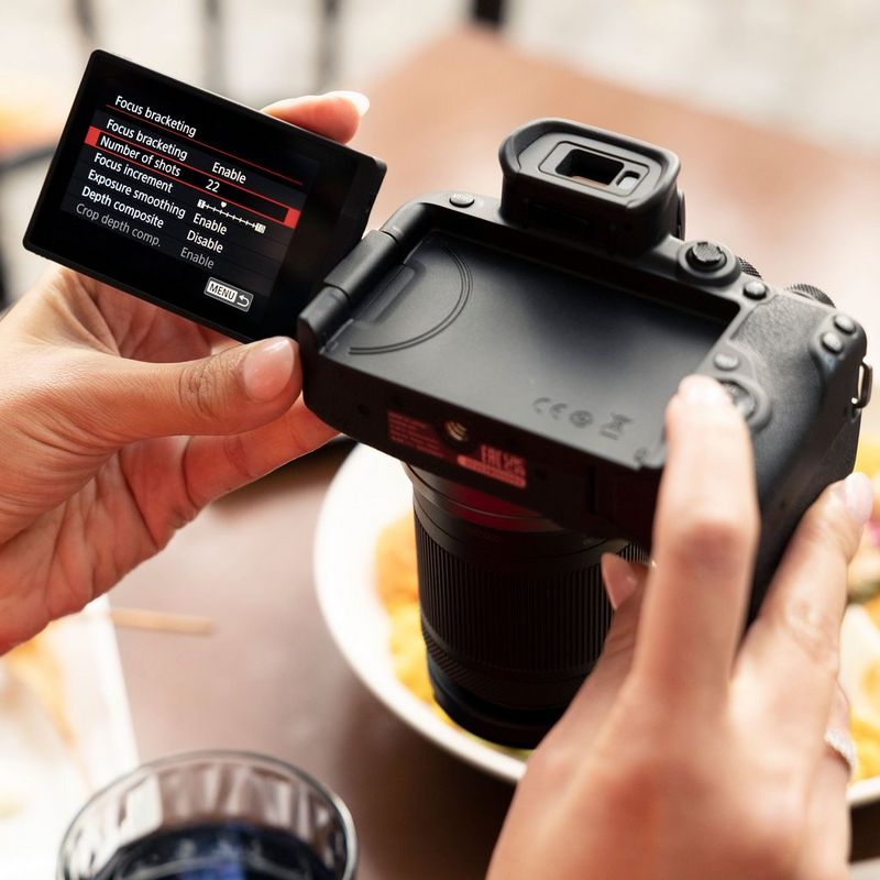 Canon EOS R10 Mirrorless Camera + RF-S 18-45mm F4.5-6.3 IS STM Lens + Backpack + SD Card + Spare Battery Lifestyle User taking photo using LV mode