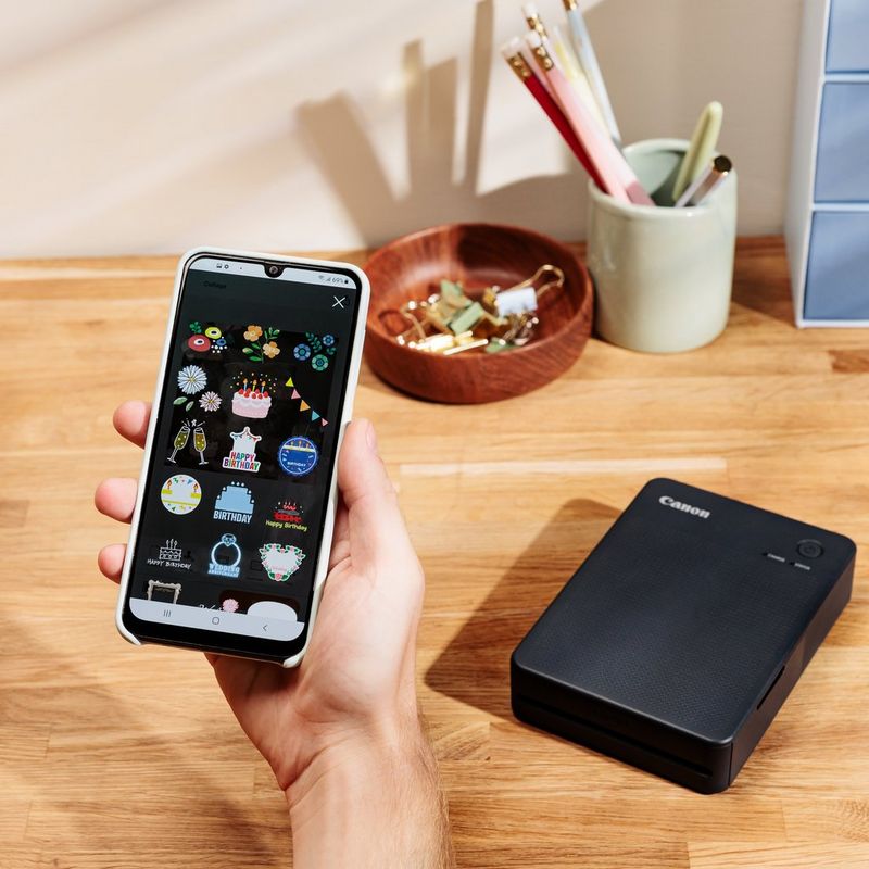 Canon SELPHY QX20 mobiler WLAN-Farbfotodrucker, Dunkelgrau Produkt mit Darstellung der Verbindung zum Smartphone