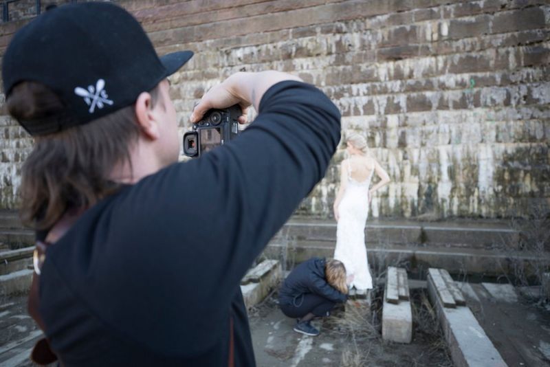 Photographer taking a picture of the bride