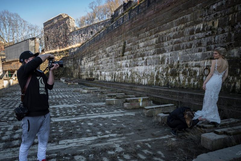 Photographer taking a picture of the bride