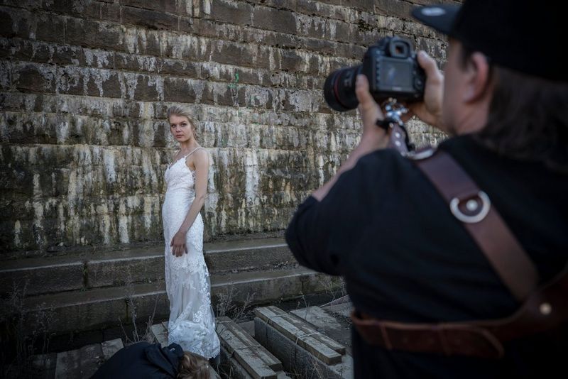 Photographer taking a picture of the bride
